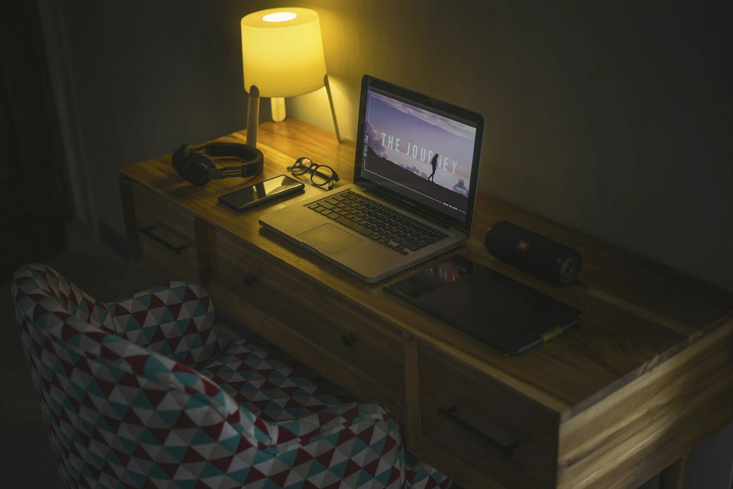 Laptop in a college dorm room, representing a first-generation student accessing telehealth therapy in Jackson, MI