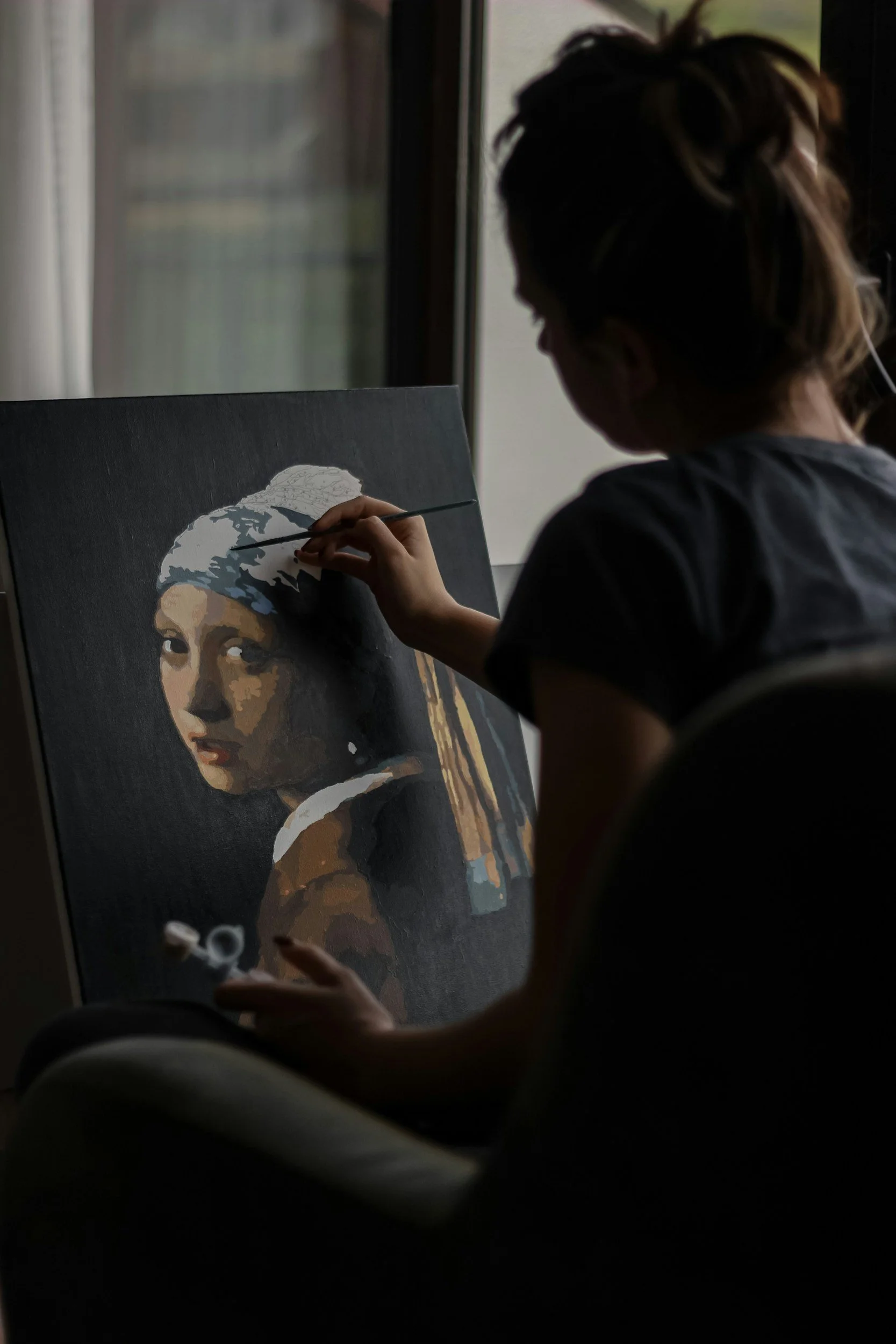 Illustration of someone painting, highlighting BPD telehealth therapy services in Jackson, MI