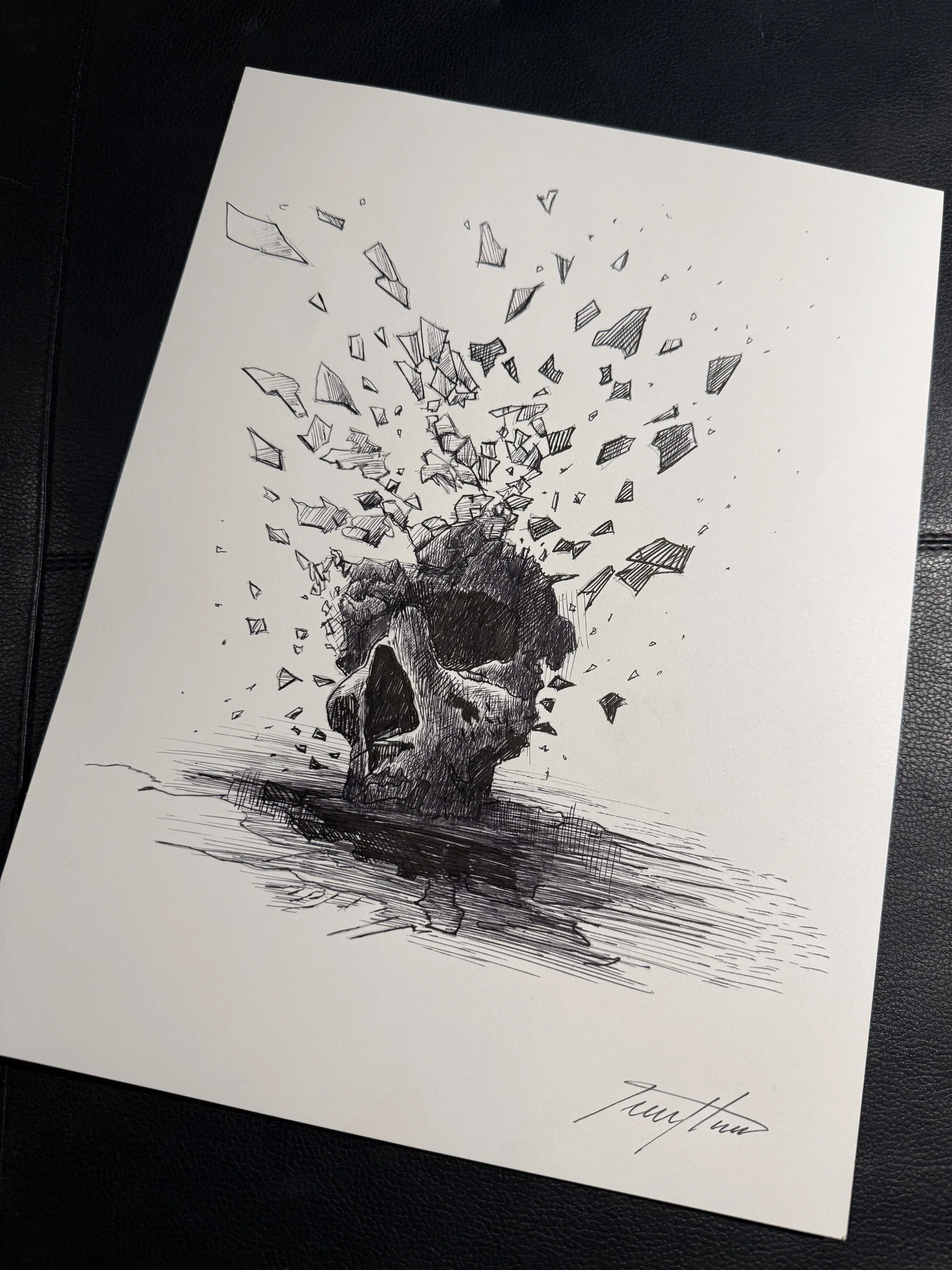 A black and white drawing of a human skull cracked open, with fragments flying outward, reflecting a surreal and intense scene.