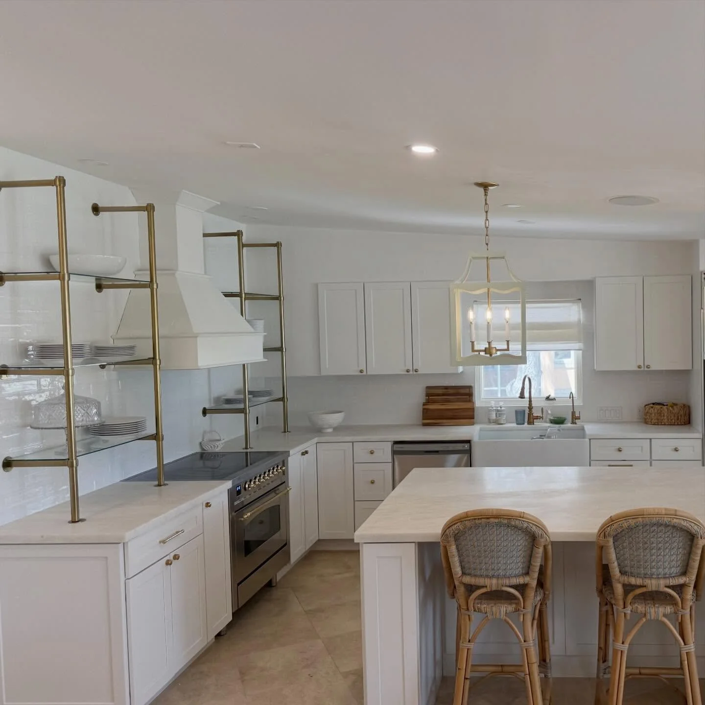 There is something about Mystery White marble that transforms a kitchen into a sanctuary. For this project, we used premium slabs for both the perimeter countertops and the expansive island to create a seamless, airy flow. The soft veining perfectly 
