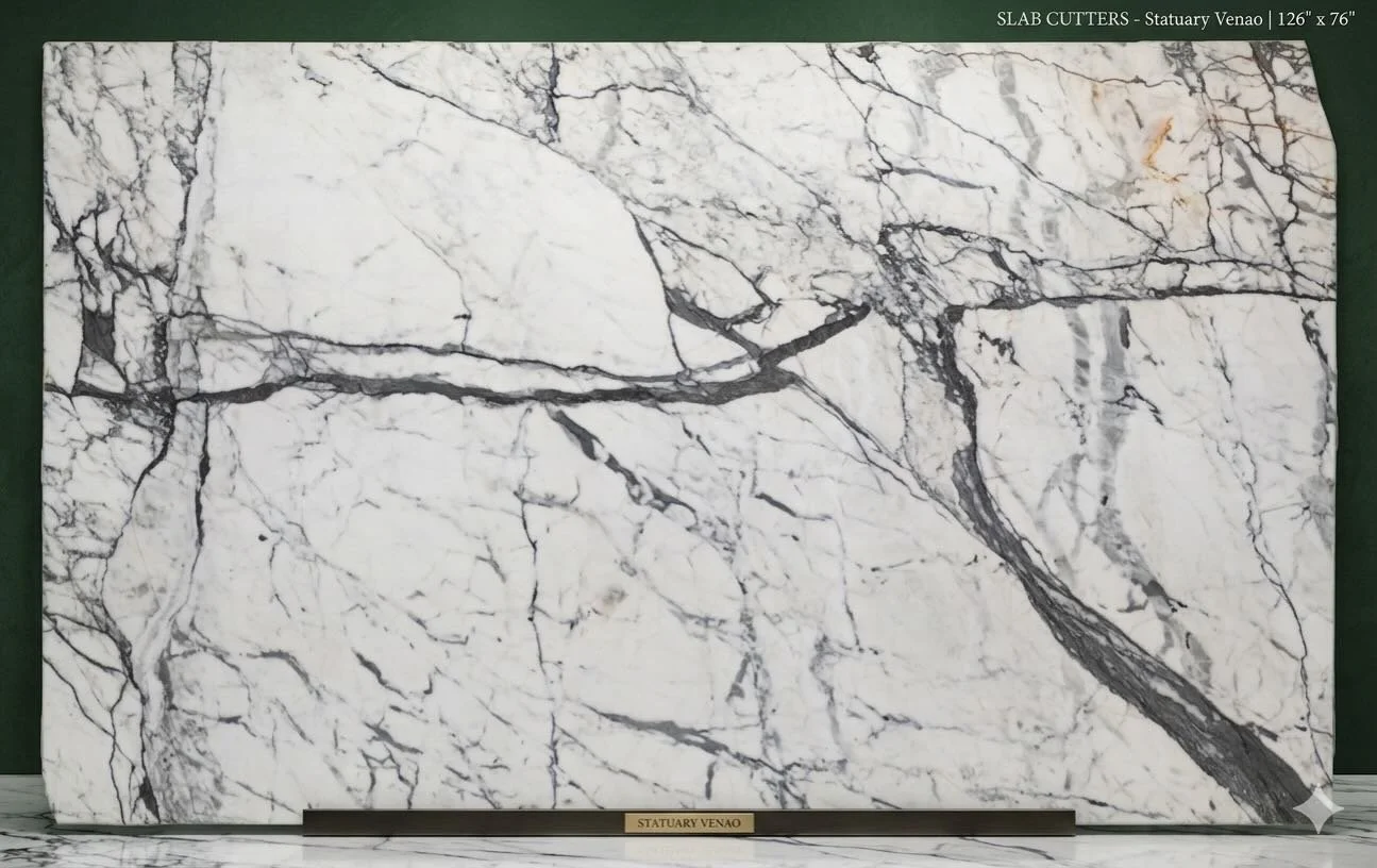 The Art of the Earth. ✨

There is nothing quite like the dramatic, sweeping veining of Statuary Venao. This particular slab offers a perfect balance of crisp white and bold charcoal movement, making it a true centerpiece for a master bath or a statem