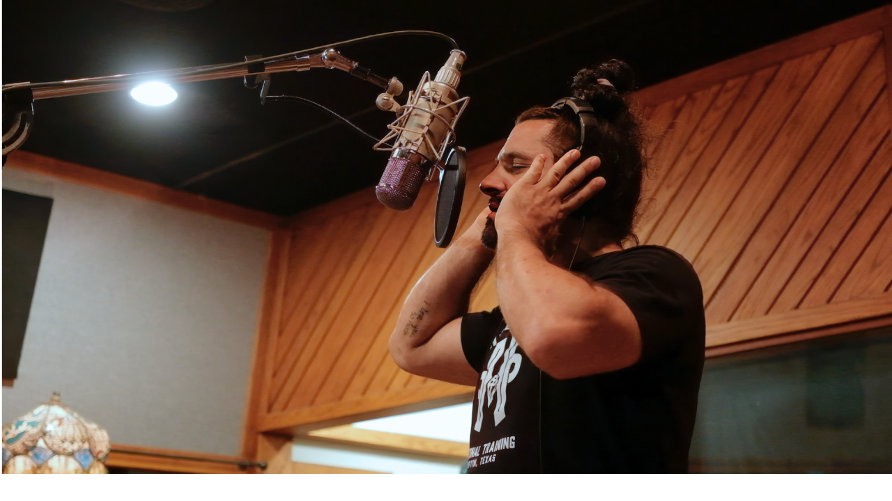 Americana folk artist Chris Bronson recording vocals at Arlyn Studios in Austin during Thunder Heart album sessions.