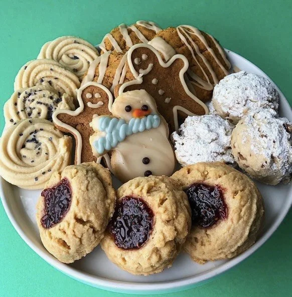 It's the sweetest time of the year! Our December holiday cookies are back in stock! Raspberry Thumbprints, Snowballs, Spritz, Pumpkin Chip, and Cut-outs are available in-shop and online for pre-orders.