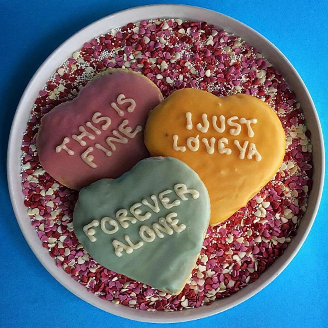 Conversation cut-out cookies are back at the bakery! Available in sweet and xxx. Pre-order for Valentine's day through our website. 🩷🩵&hearts;️