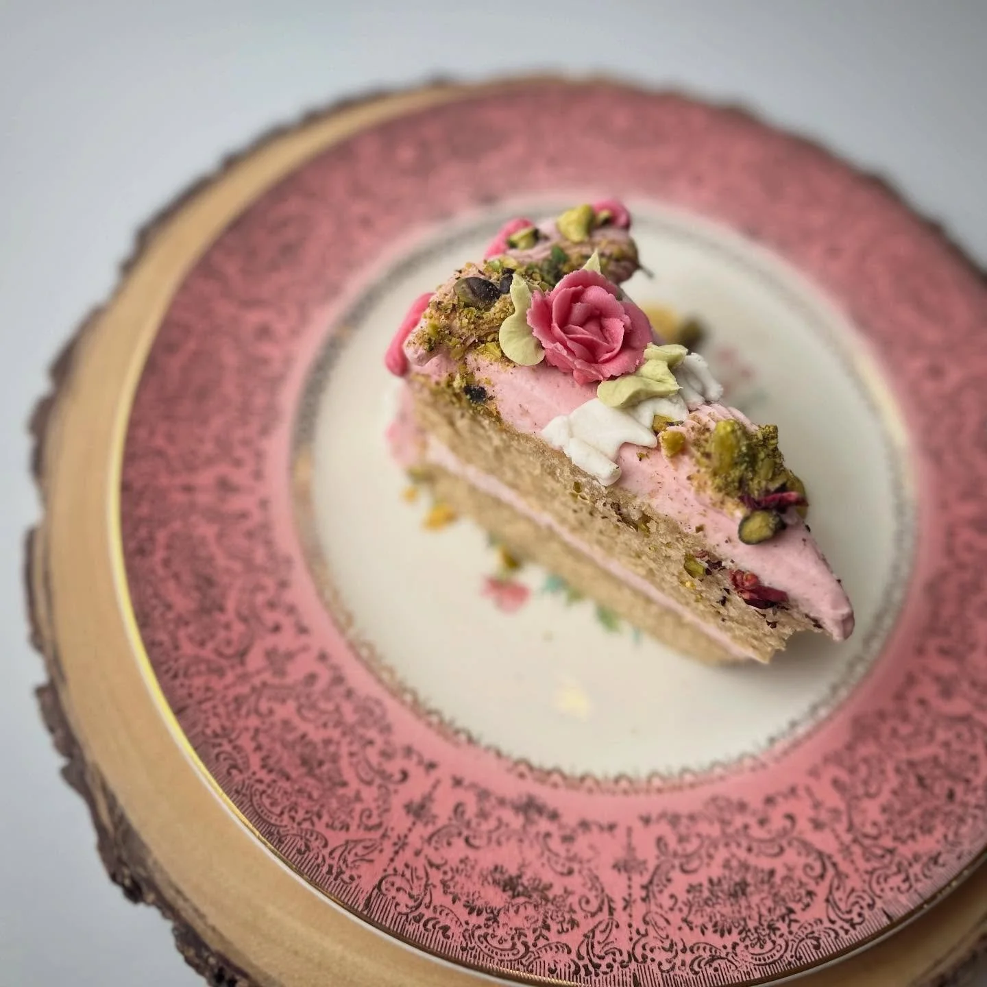 Our cake by the slice today is pistachio rosewater perfection! This cake and icing are infused with cardamom and rosewater flavors topped with pistachios. 🍰
