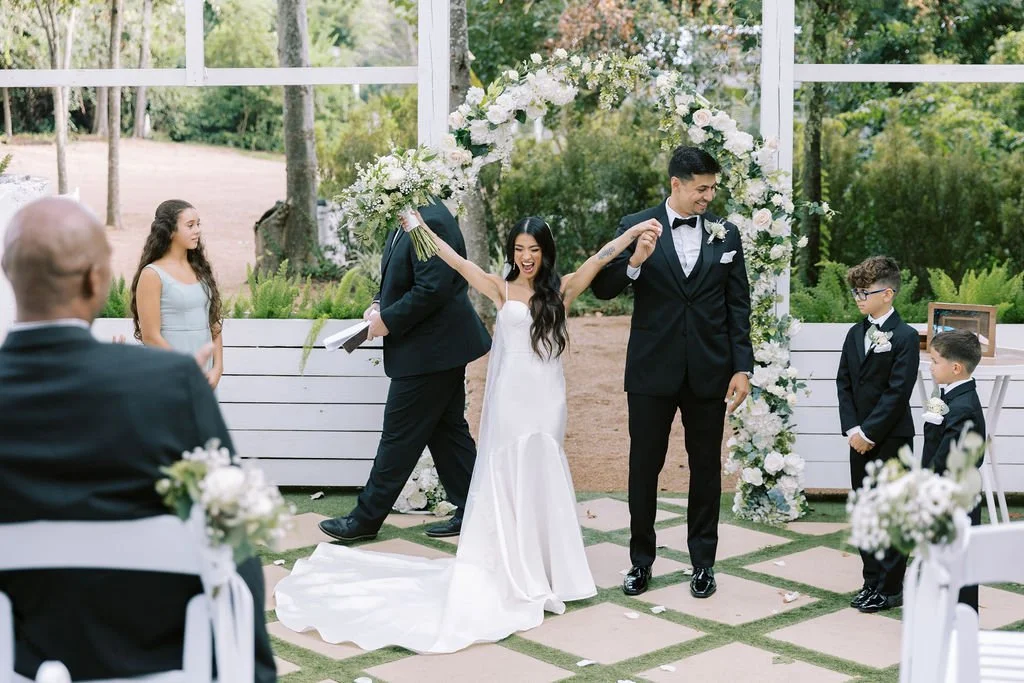 Couple at a summer greenhouse wedding ceremony in Houston, Texas