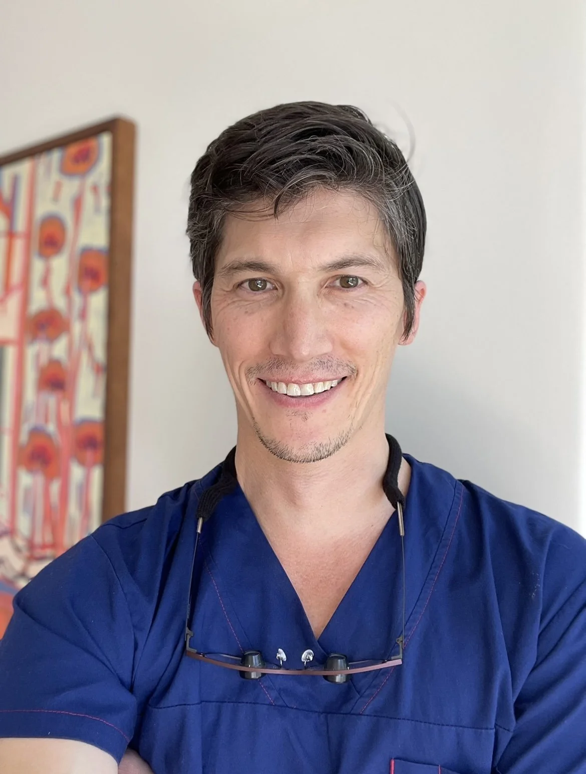 A smiling plastic surgeon. Dr Edwin Morrison. Plastic Surgery. Melbourne plastic surgeon. Ballarat plastic surgeon. Hawthorn plastic surgeon.