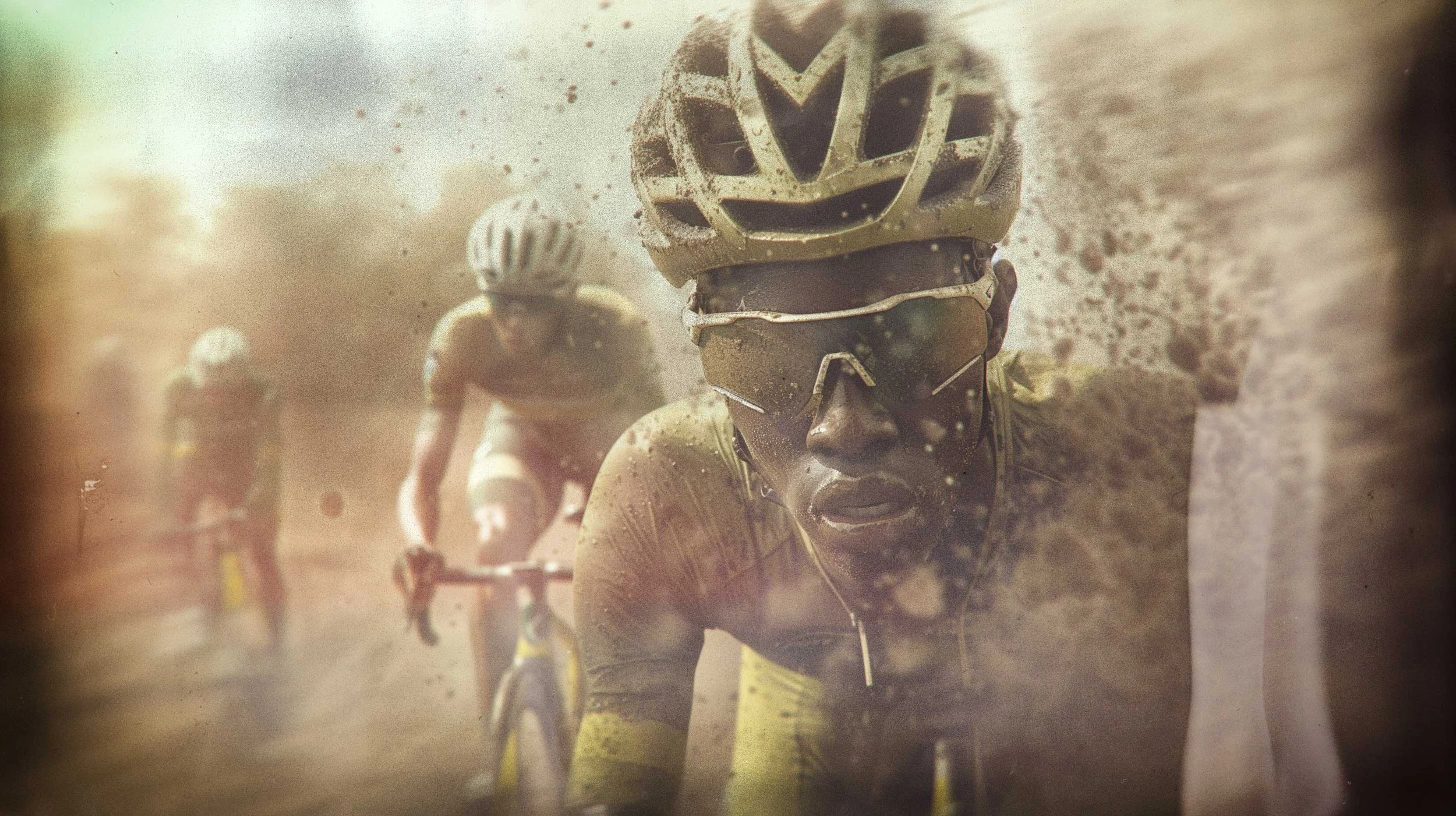 Gravel cyclist racing through a dusty landscape, featured in the Grabva visual identity project.