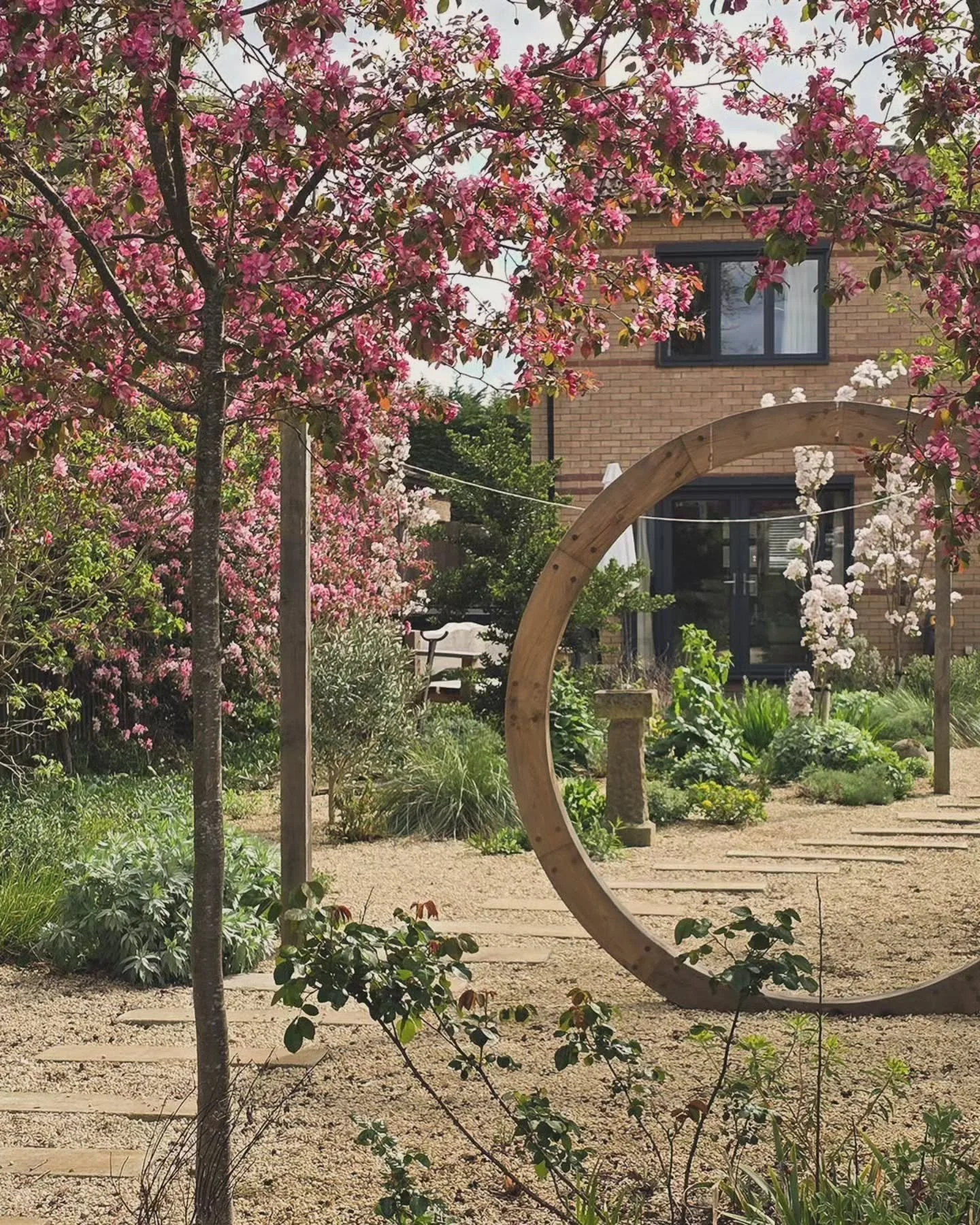 Spring visit to our Cambridgeshire Wildlife Garden.  Everything looking fresh, and being safely guarded by one of the clients.

We started here with a fairly blank canvas at ground level, working with the bonus of having some established structure in