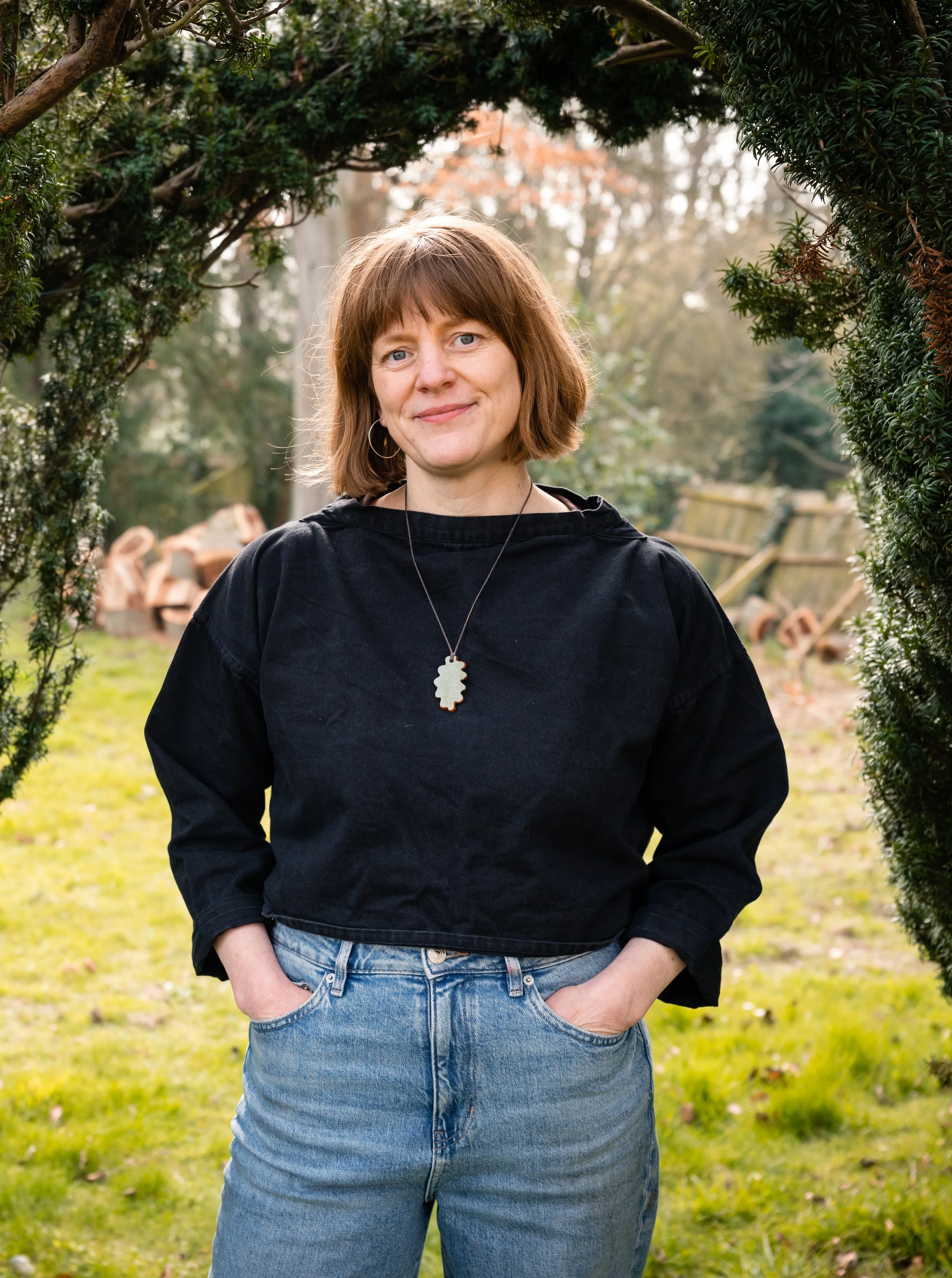 profile of lucy conochie with hedge