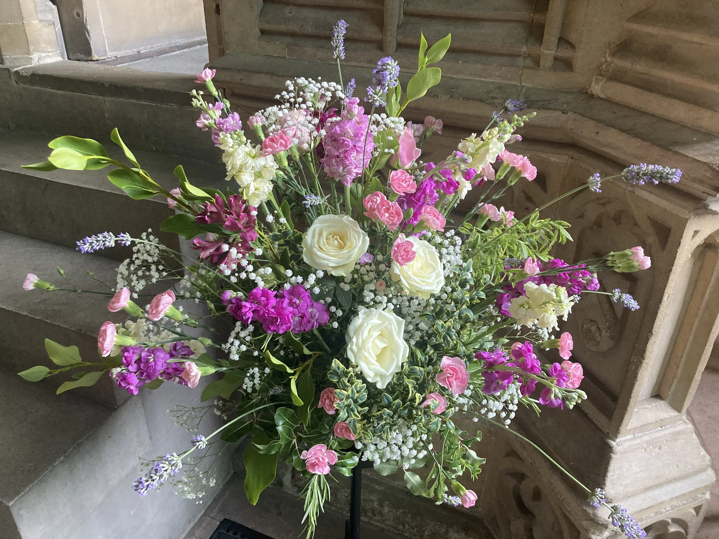 A pink and white flower arrangement