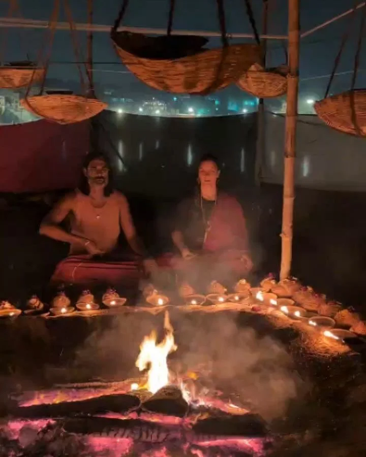 On a long stretch of deserted riverbank, flooded half the year when the Himalayan snow melts, Guruji built a camp (or an interdimensional Tantrik spaceship?) in the billowing white sand. And there, he built a fire. A yagna that burned for nine days a