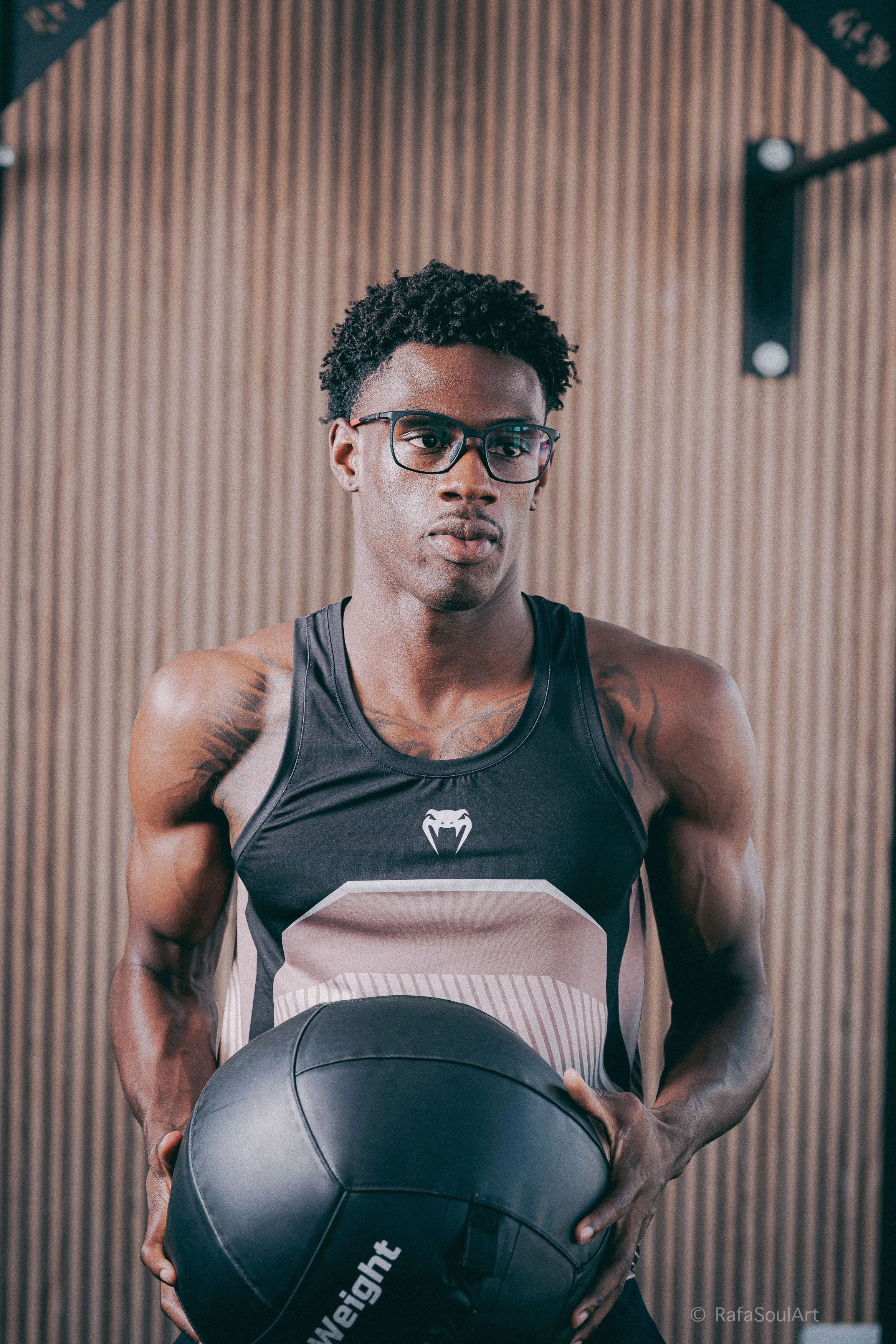 Athlete wearing Hilx Vizo prescription glasses standing outdoors during commercial photoshoot