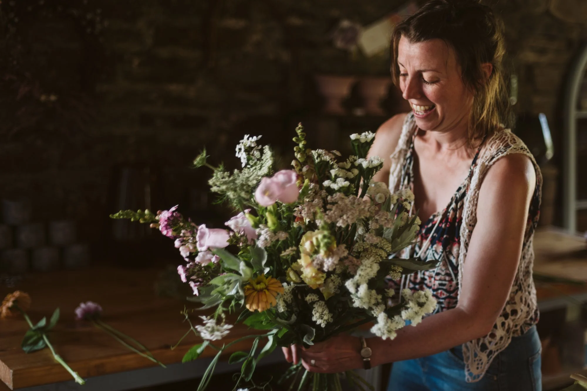 Flicky Howe from Howe Hill Flowers by Anna Groniecka Photography holding a big bunch of her garden flowers