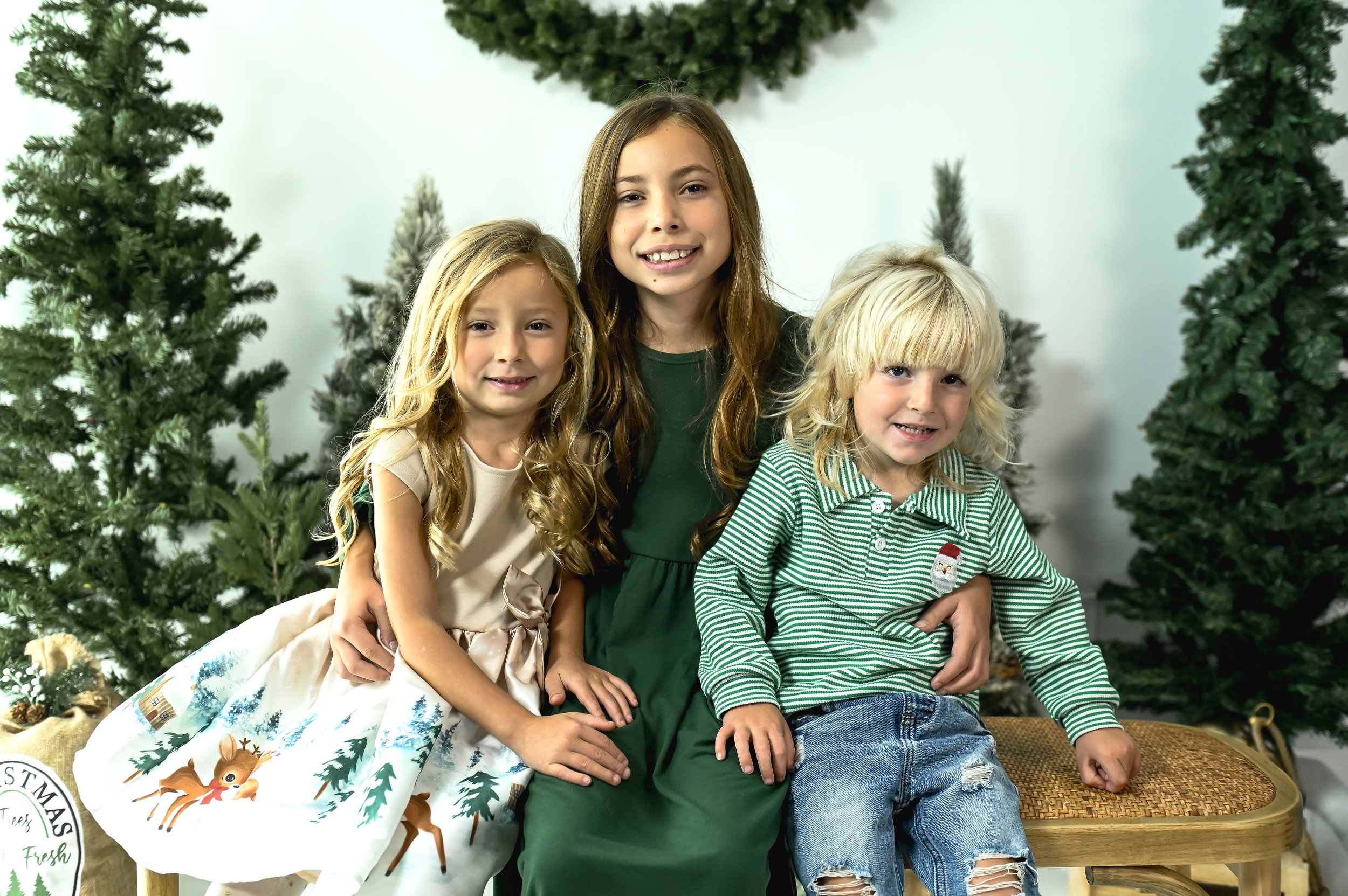 Siblings posing in festive woredrobe