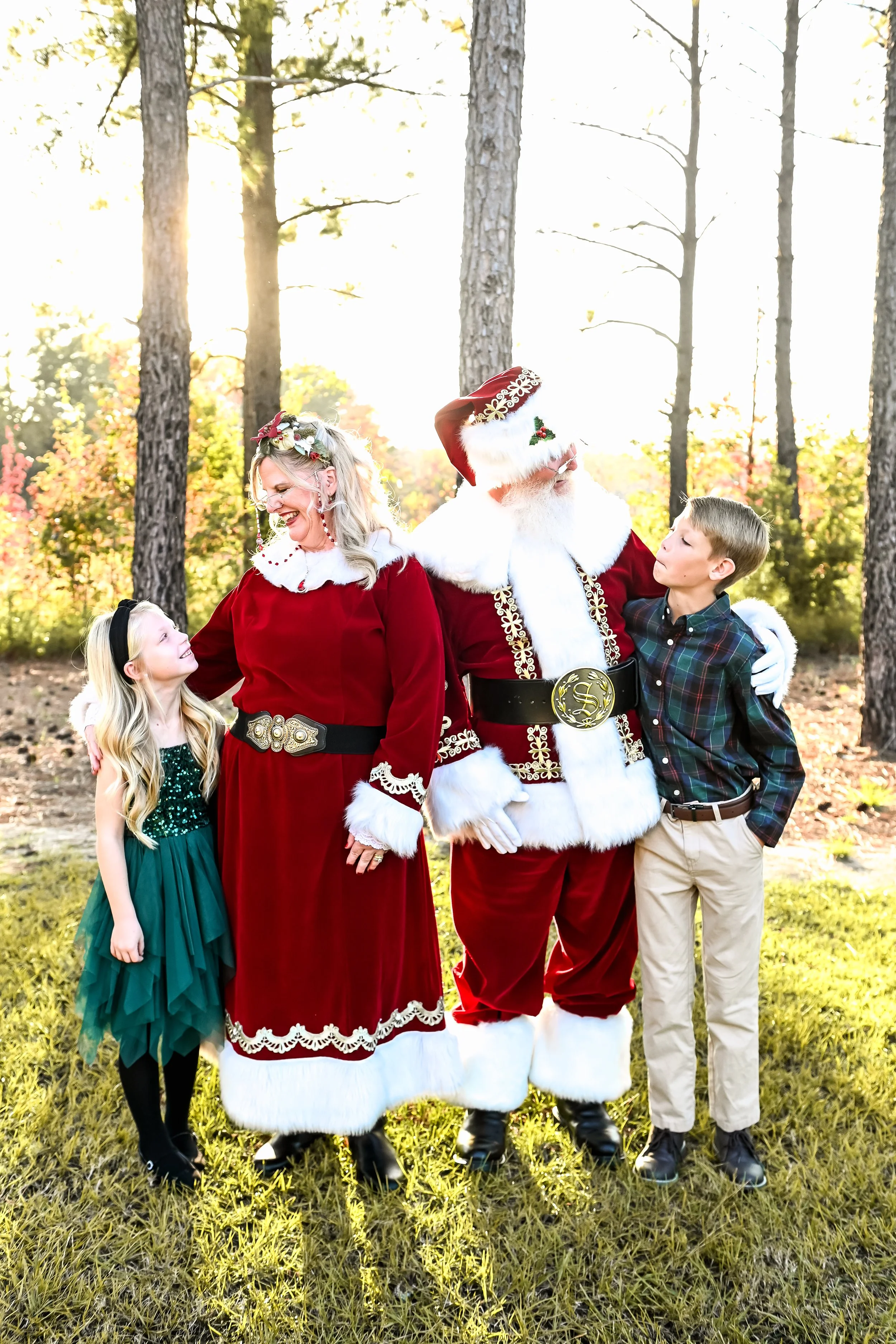 Santa and Mrs Claus posing with siblings Santa Experience