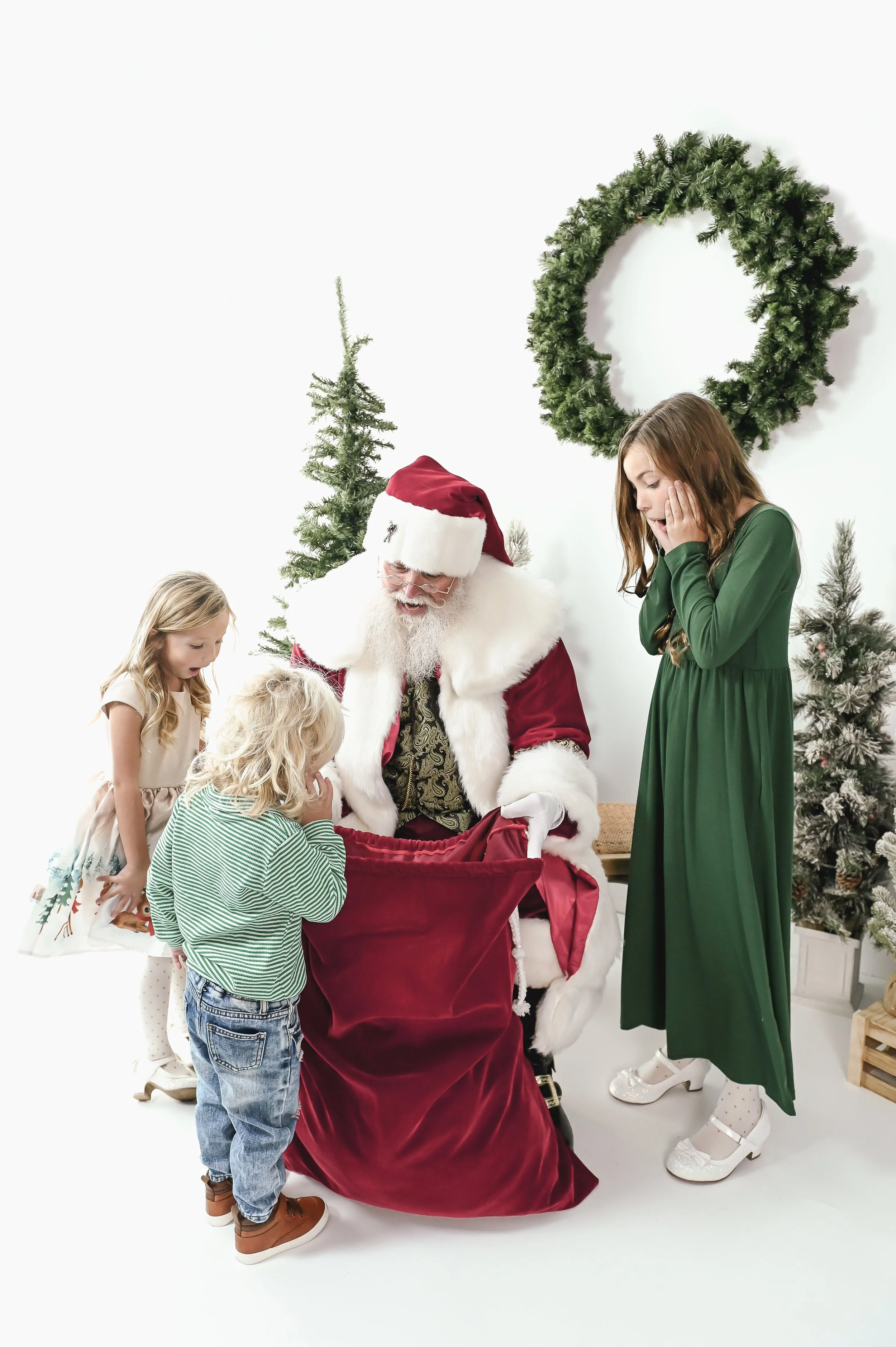 Santa Showing kids his Santa sak