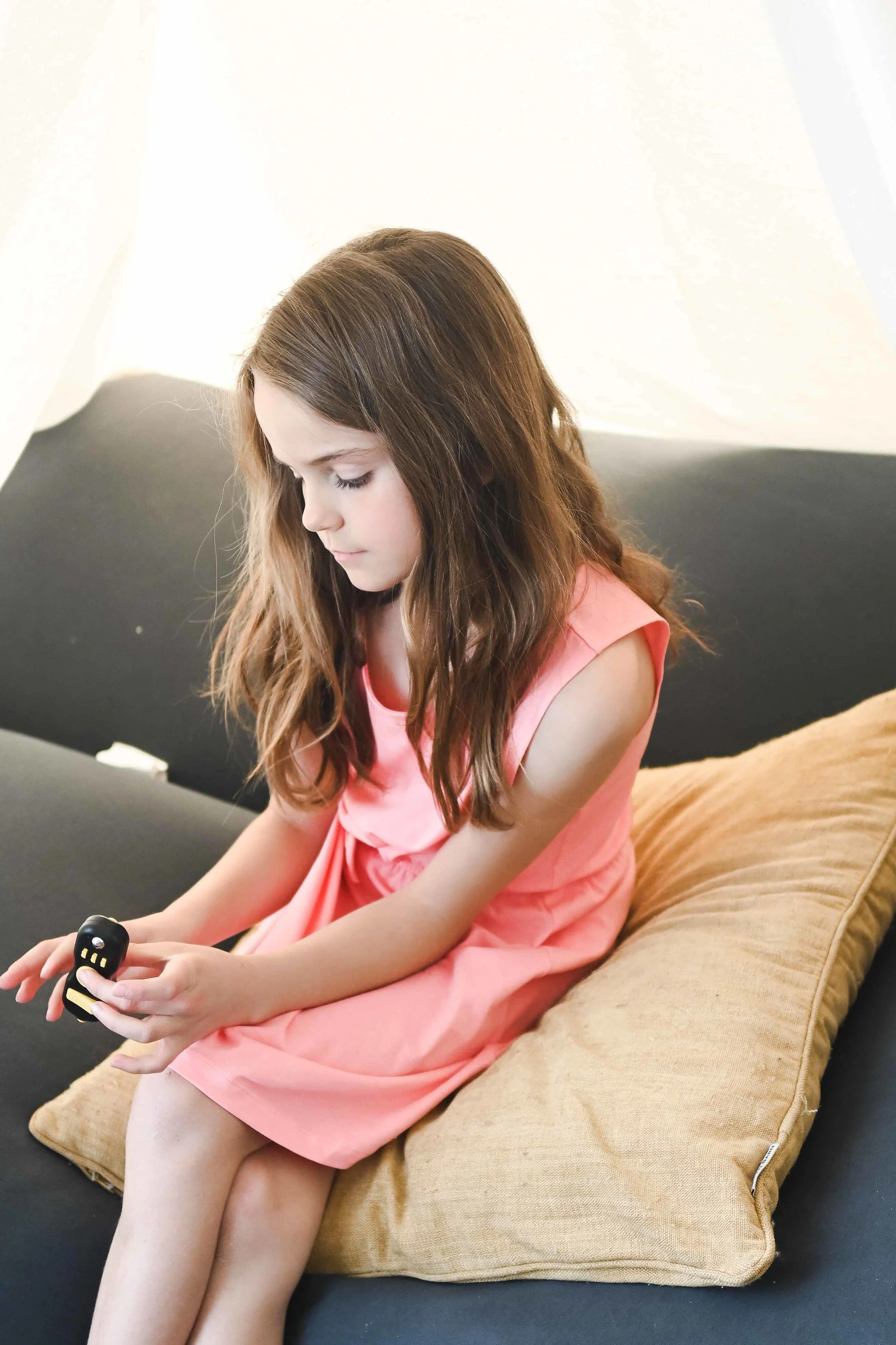 Child appearing overwhelmed after school, a common sign of masking in neurodivergent children