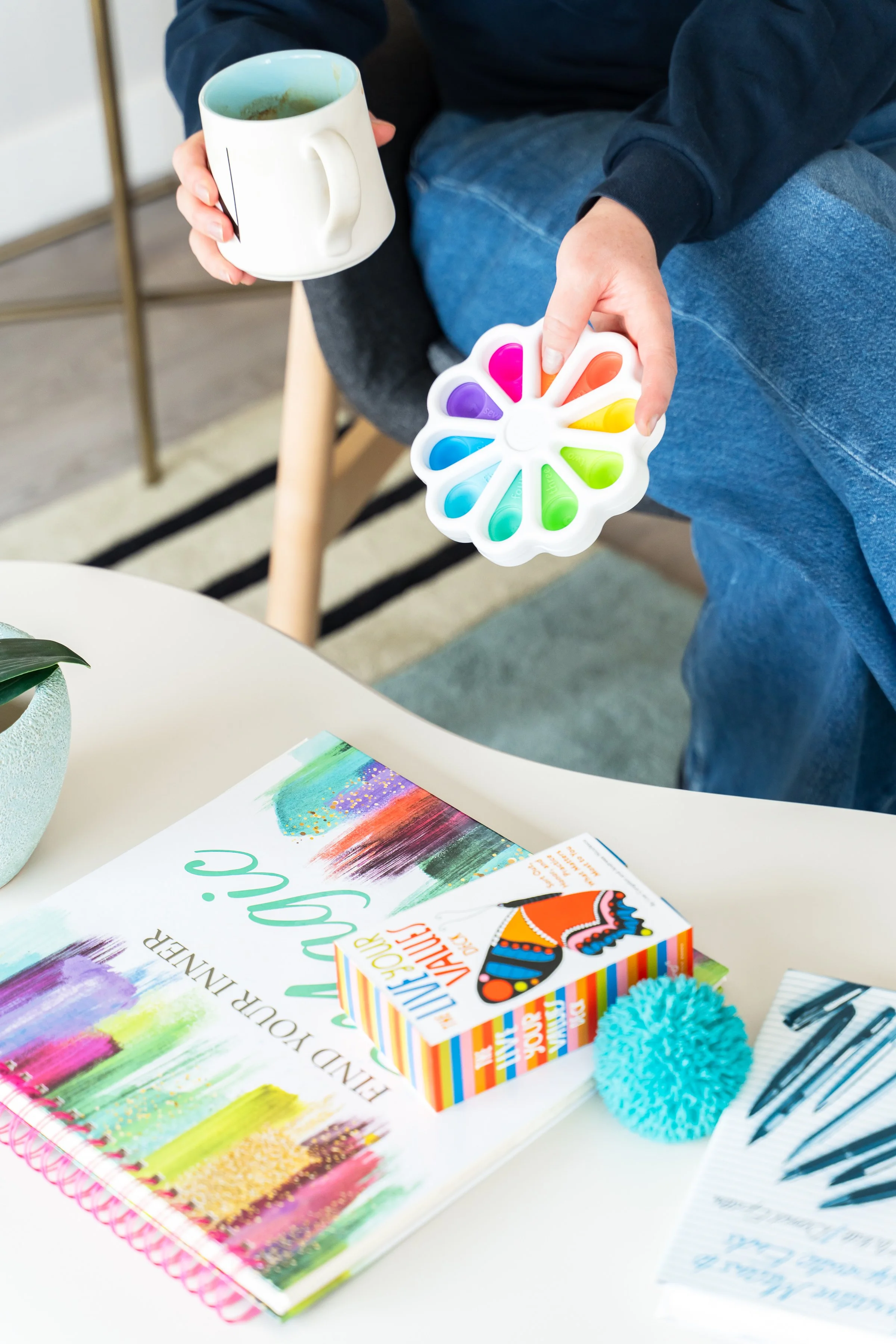 A colourful child art and play therapy workbook on a table at Creative Sky Psychology in Calgary, used in early intervention sessions with young children.