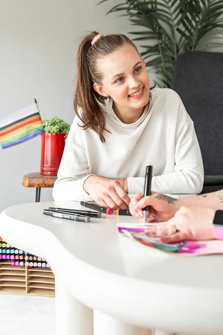 Young person feeling safe and accepted during affirming gender identity and sexuality support with a child psychologist in Calgary at Creative Sky Psychology