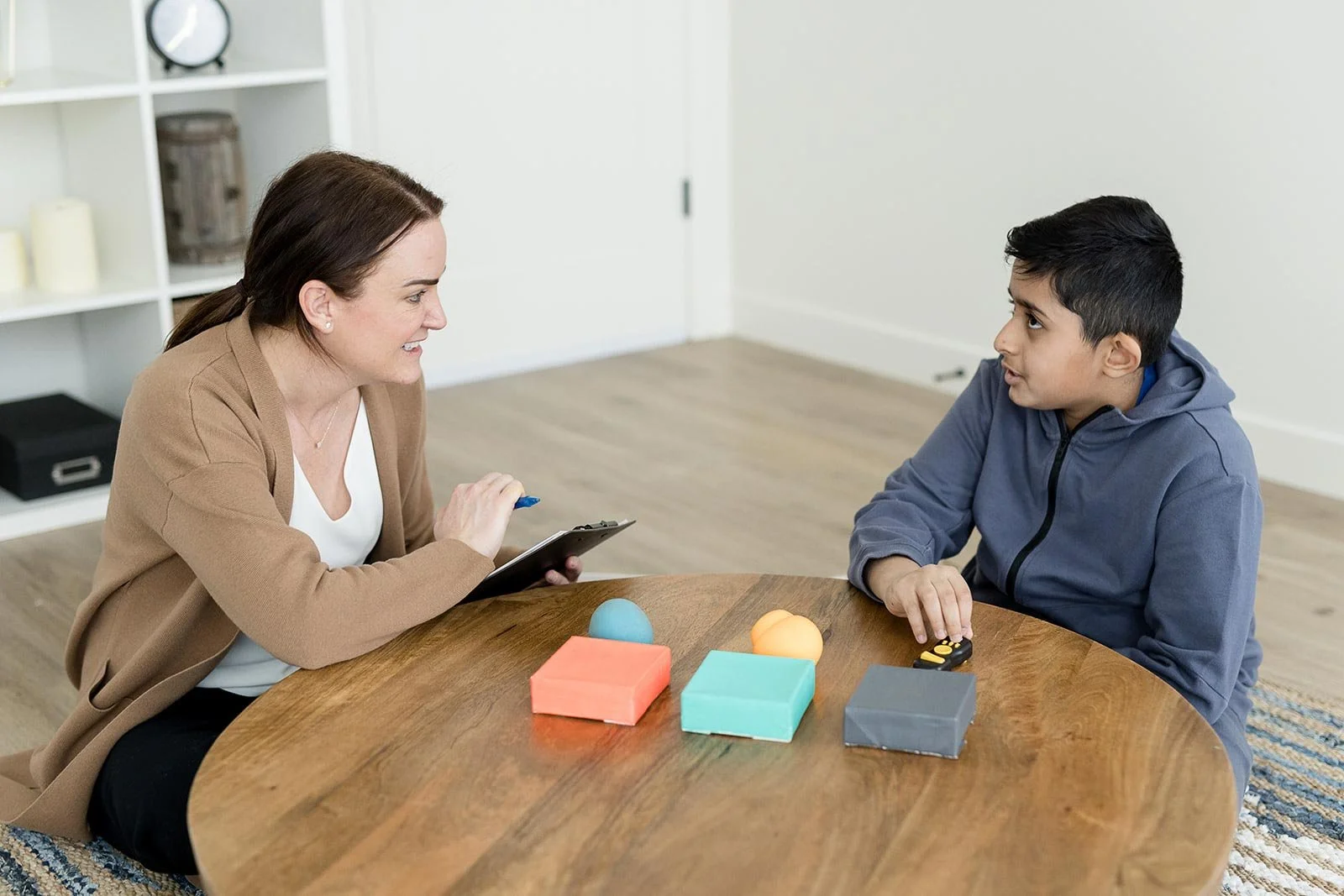 Child psychologist working with a boy during school refusal therapy in Calgary at Creative Sky Psychology, building confidence and a supported return to school.