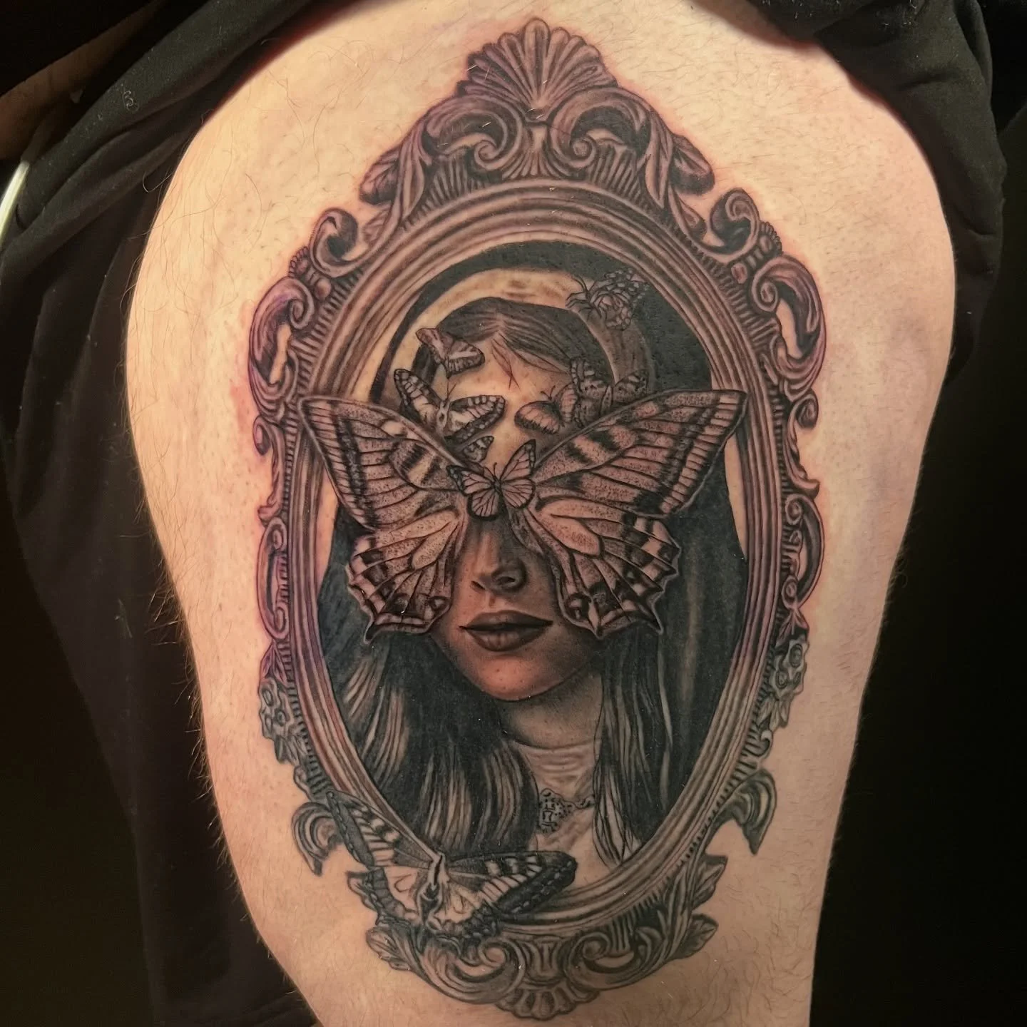 woman face moth tattoo black grey