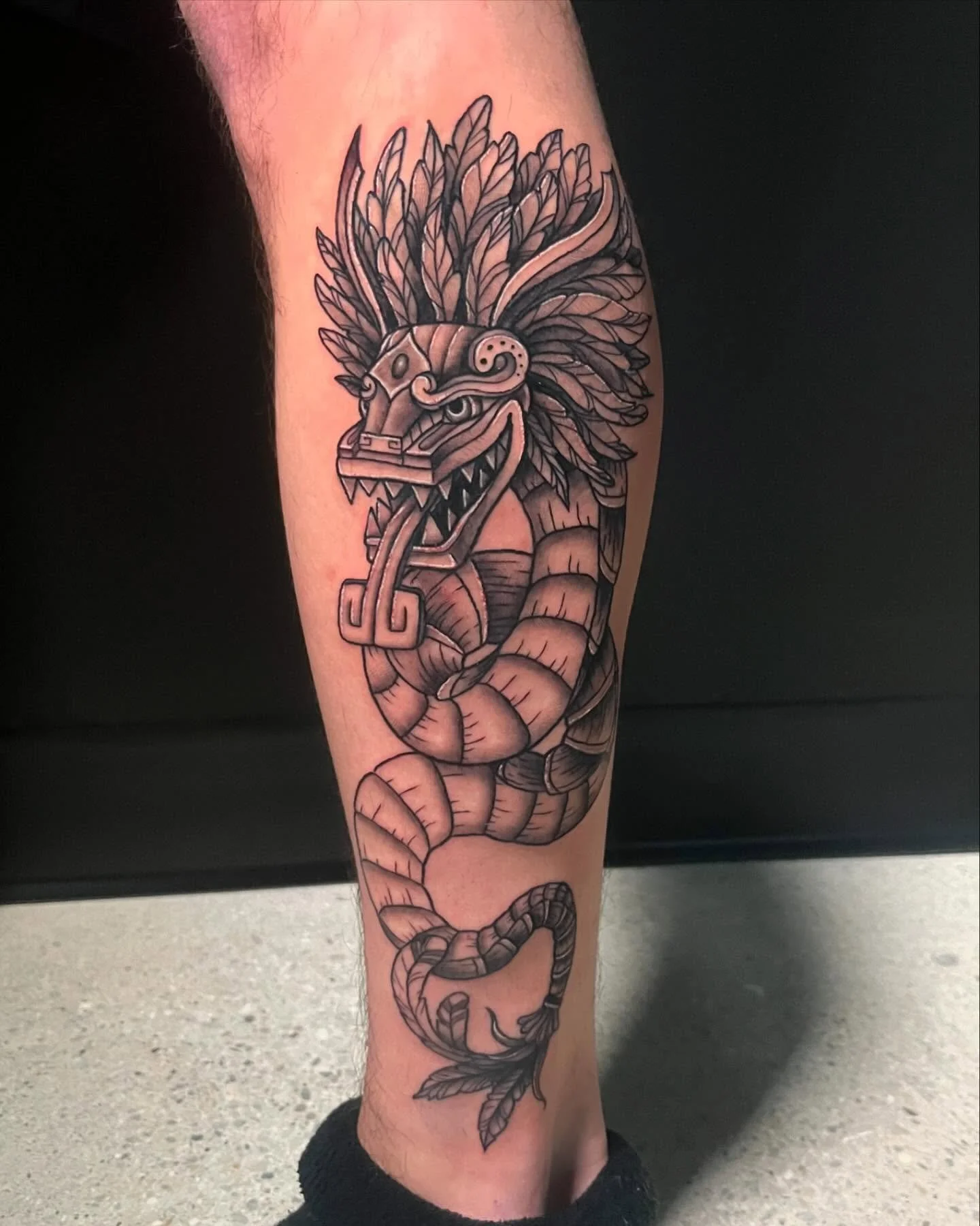 neotraditional black grey snake tattoo