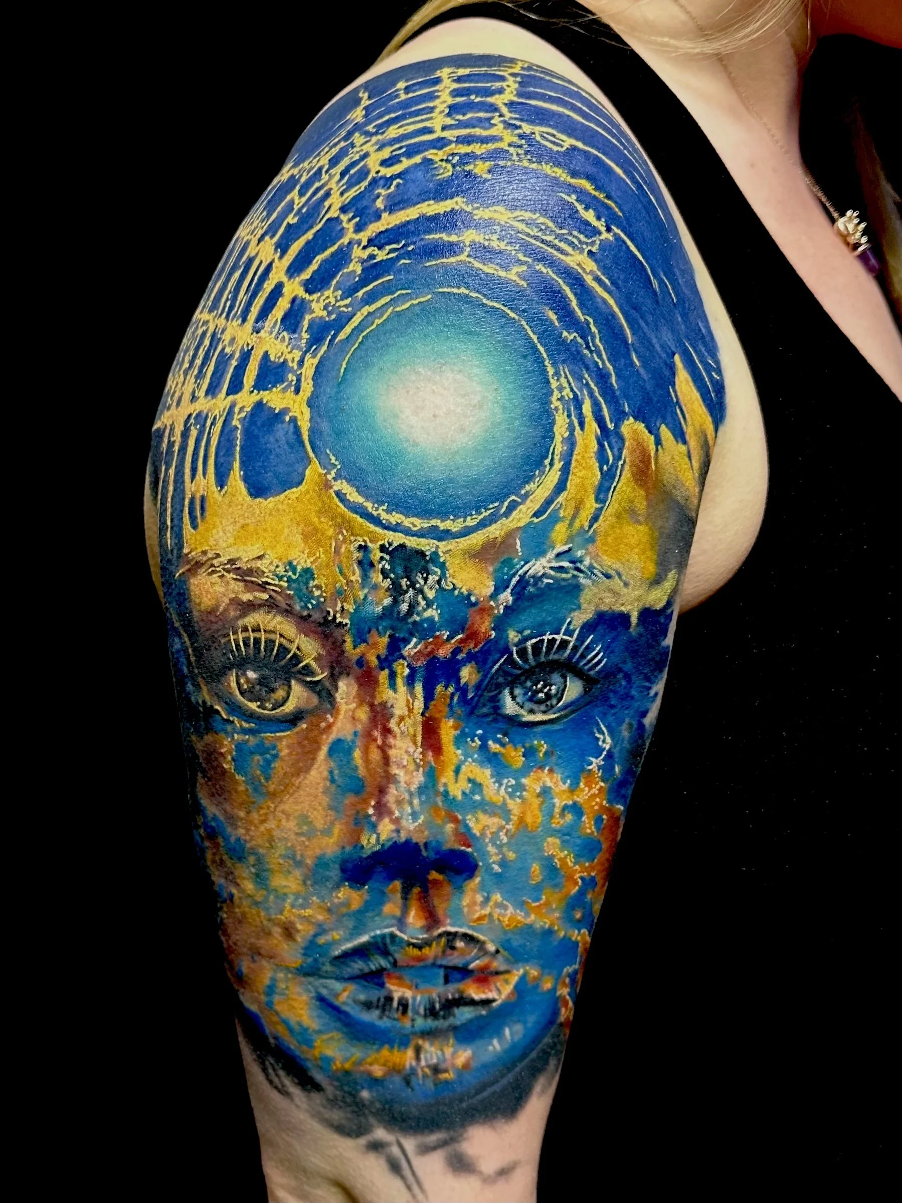 blue yellow surrealism tattoo