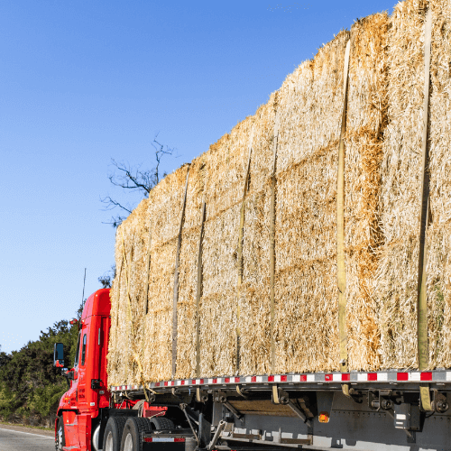 truck hauling hay for agriculture jobs in the USA