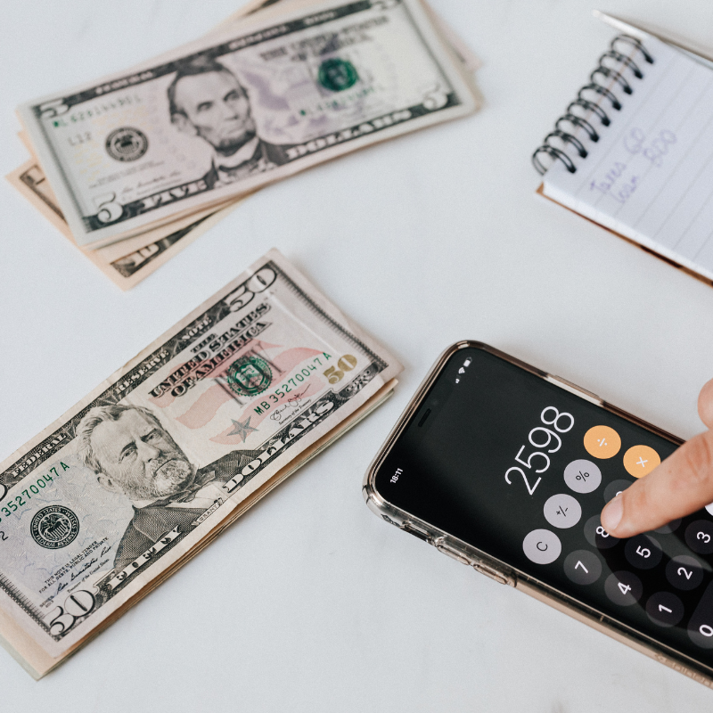 image of money and a calculator for financial tips to work in America guide