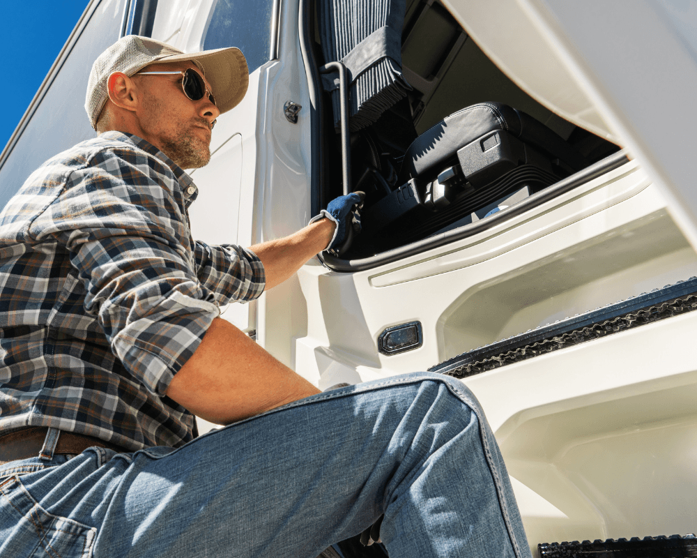 image of truck driver climbing into cab showing differences between H2A vs H2B driving jobs in America