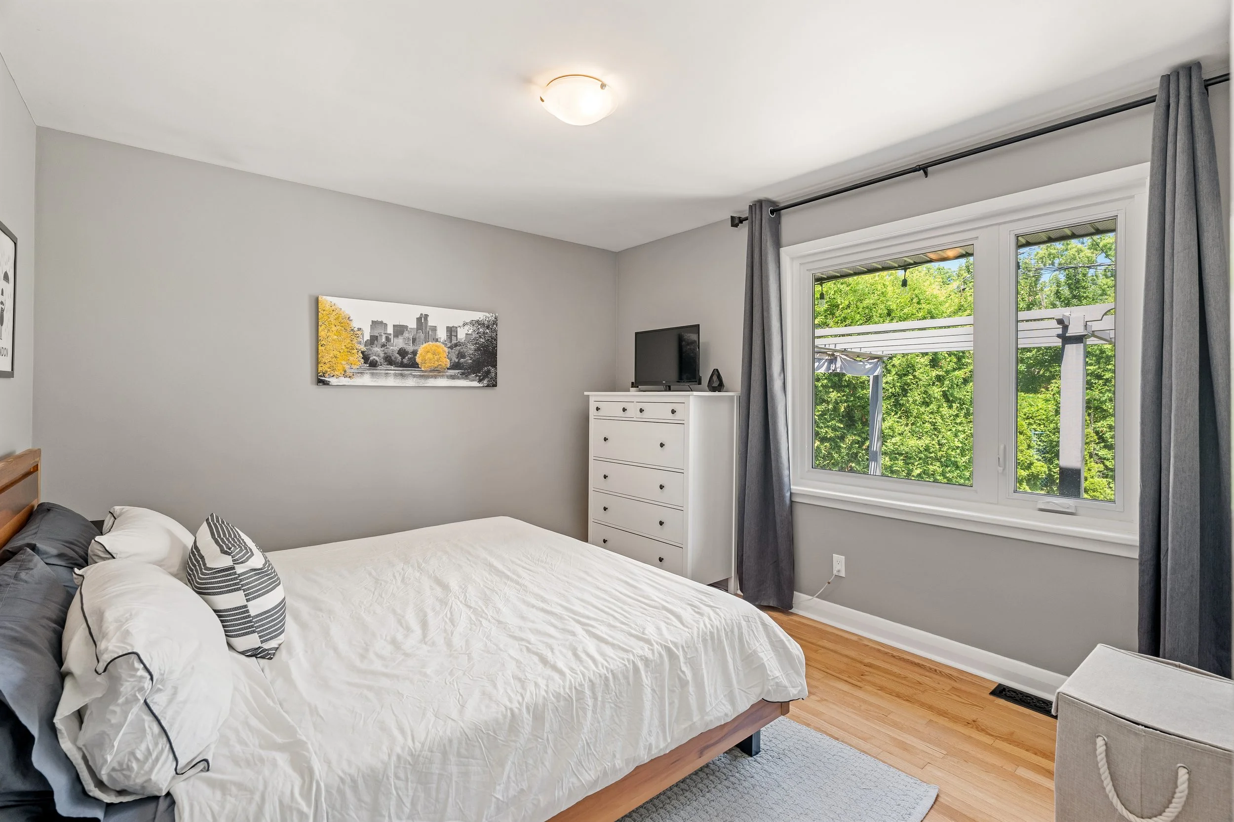 Primary bedroom features a large window and great closet space.