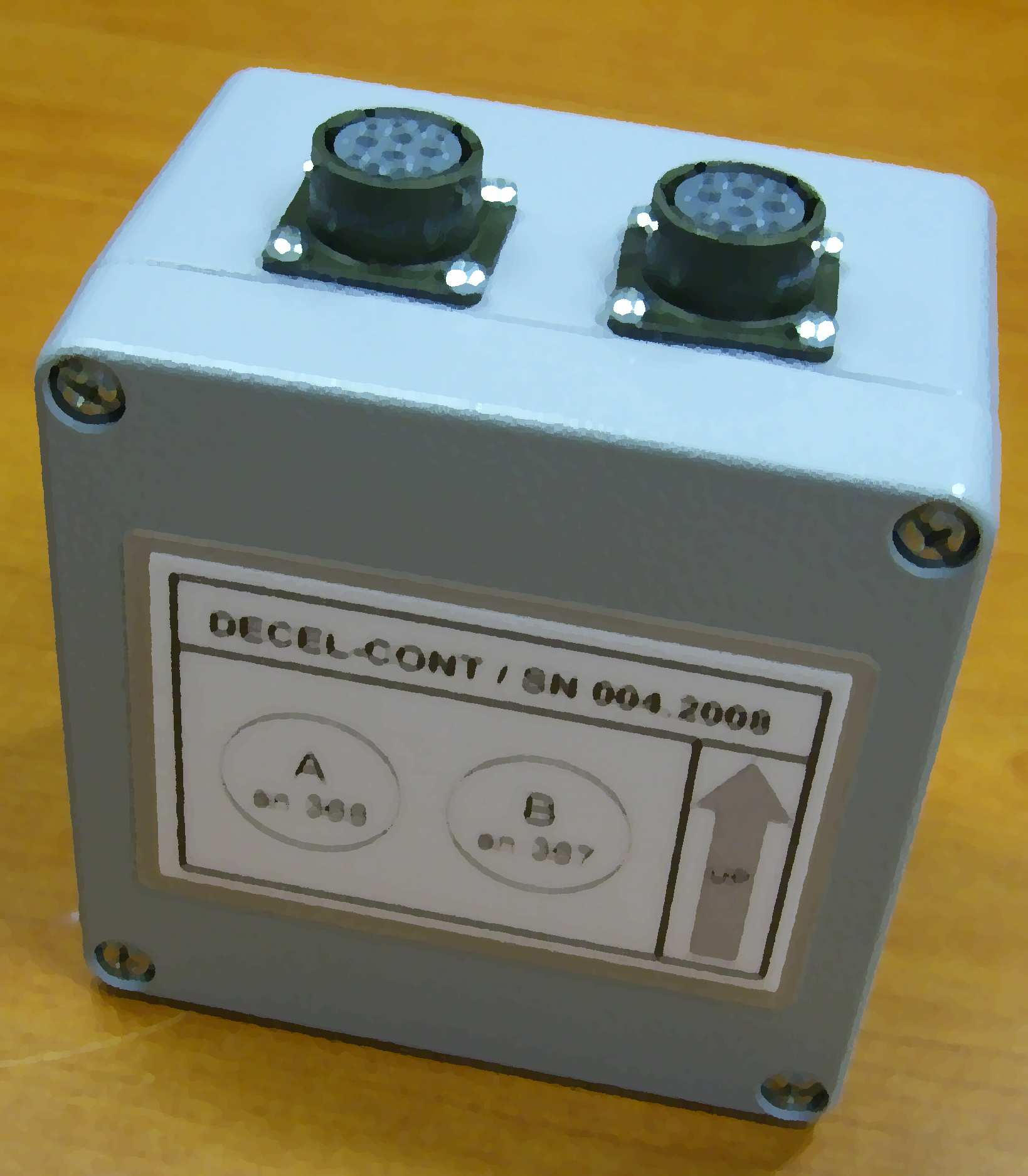 Deceleration control device with connectors on top, labeled "DECEL-CONT / SN 004, 2008" with A and B indicators on metal casing.