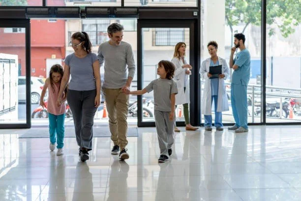 family entering hospital flooring game with epoxy