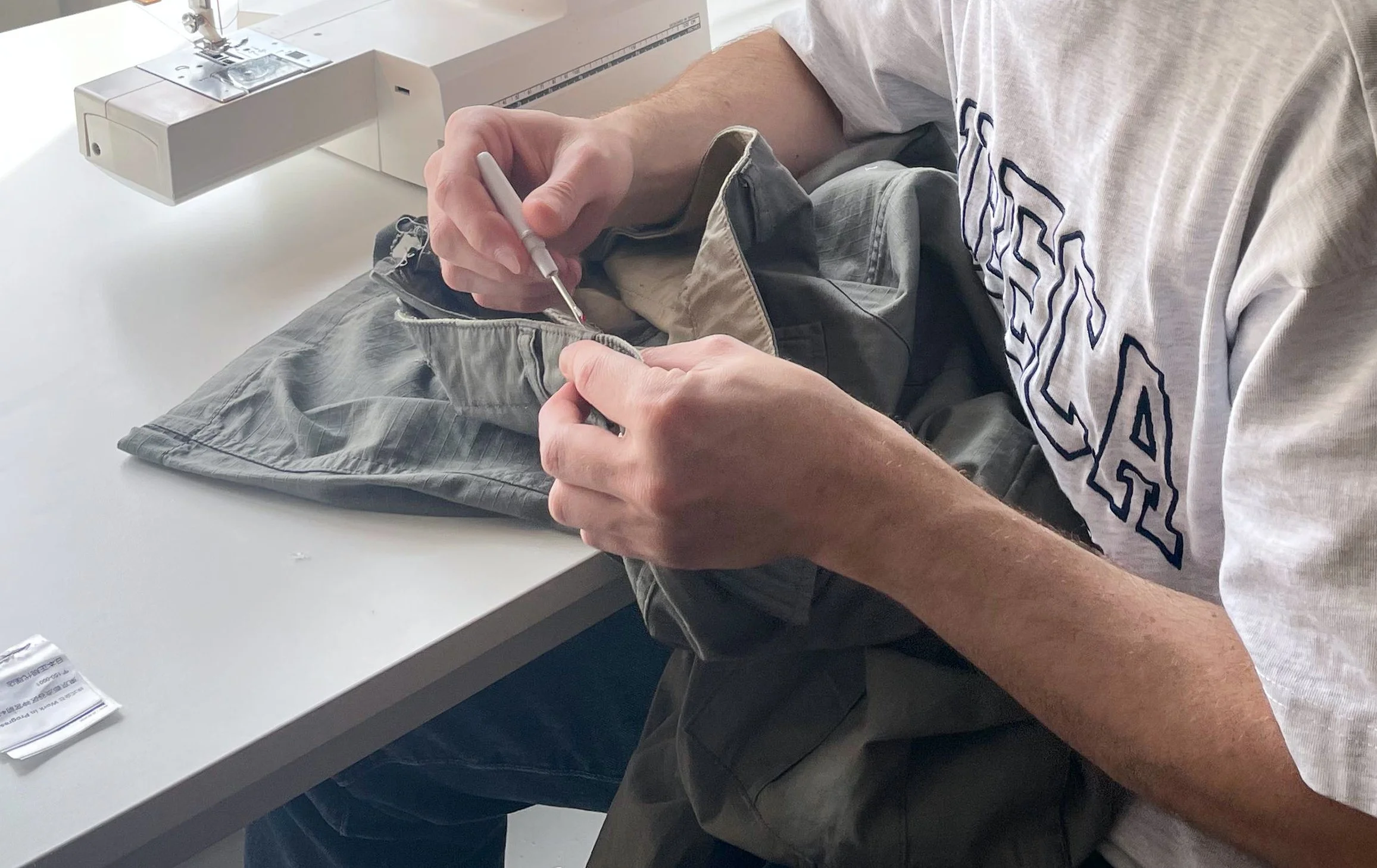 Mending trousers at a sewing workshop.jpg