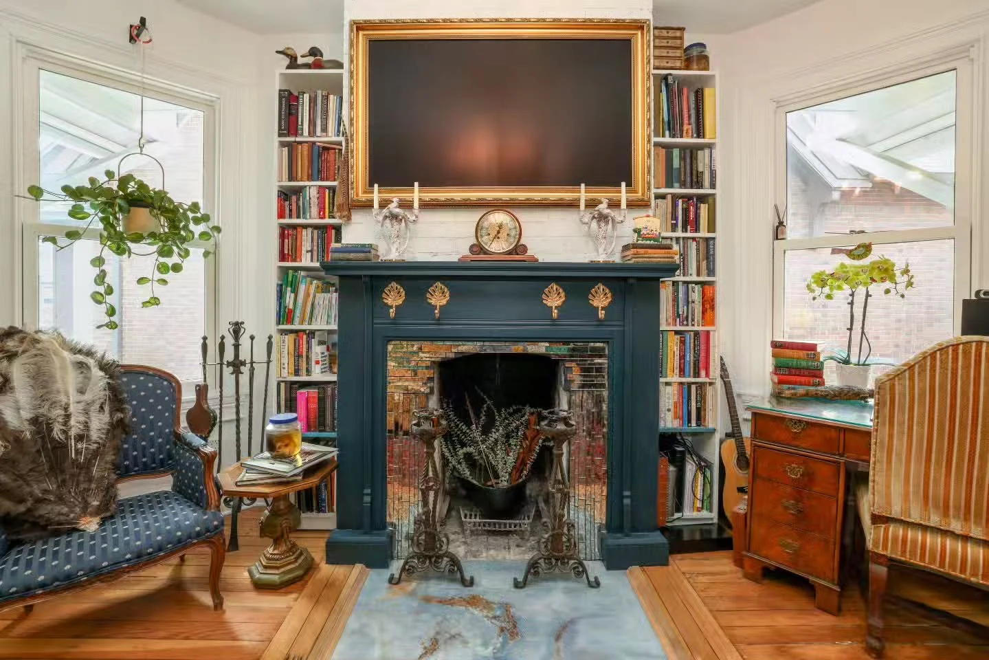 Fireplace Appreciation Moment 🔥

Deep teal mantel, golden details, and that dreamy iridescent tile? We&rsquo;re in love!
And don&rsquo;t miss the bold blue floor inset, perfectly framed in original hardwood&mdash;pure vintage magic.

Total heart-eye