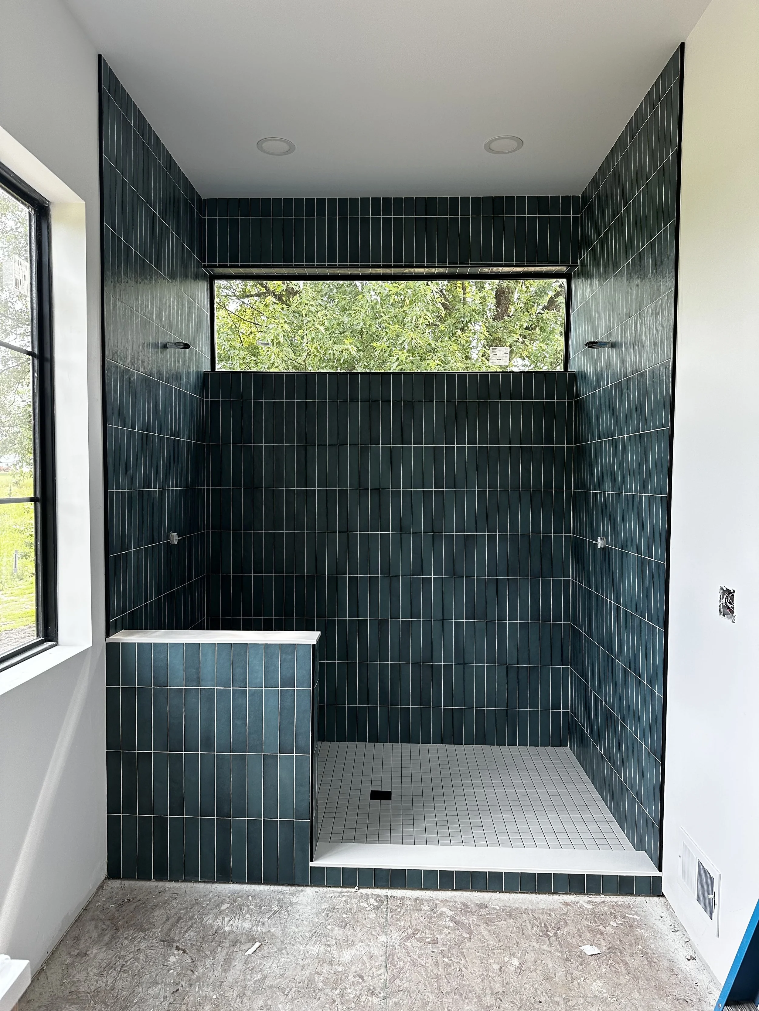 Shower with green ceramic tiles