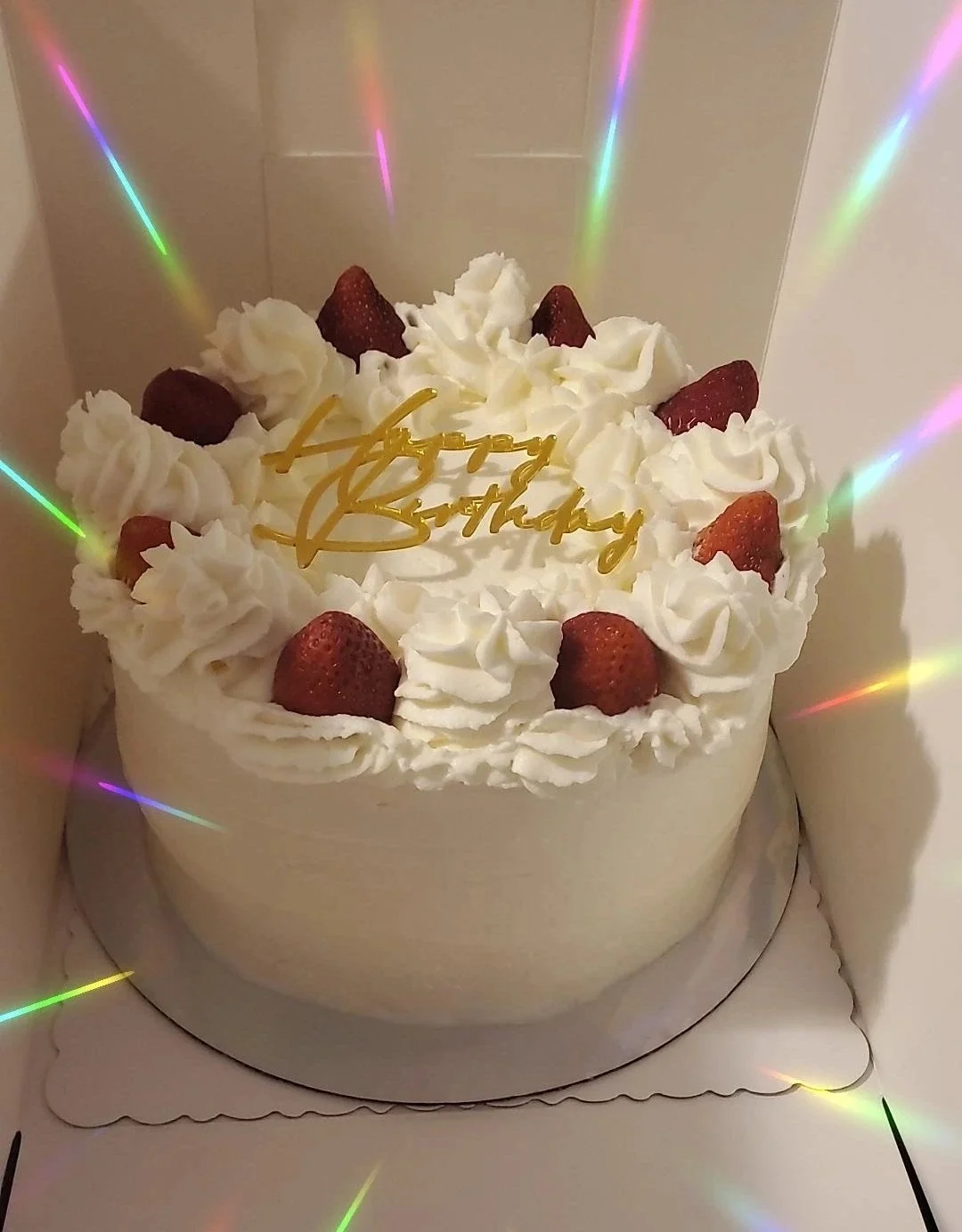 white happy birthday cake with strawberries