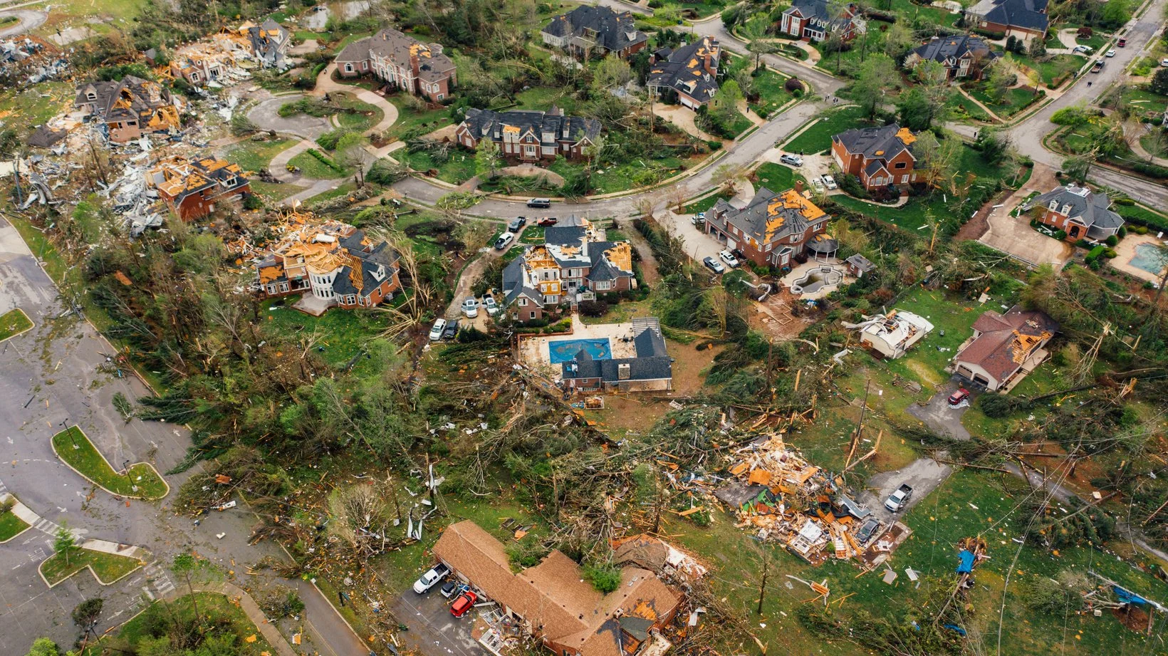 Damaged and destroyed homes in a neighborhood following a storm in Chattanooga, TN