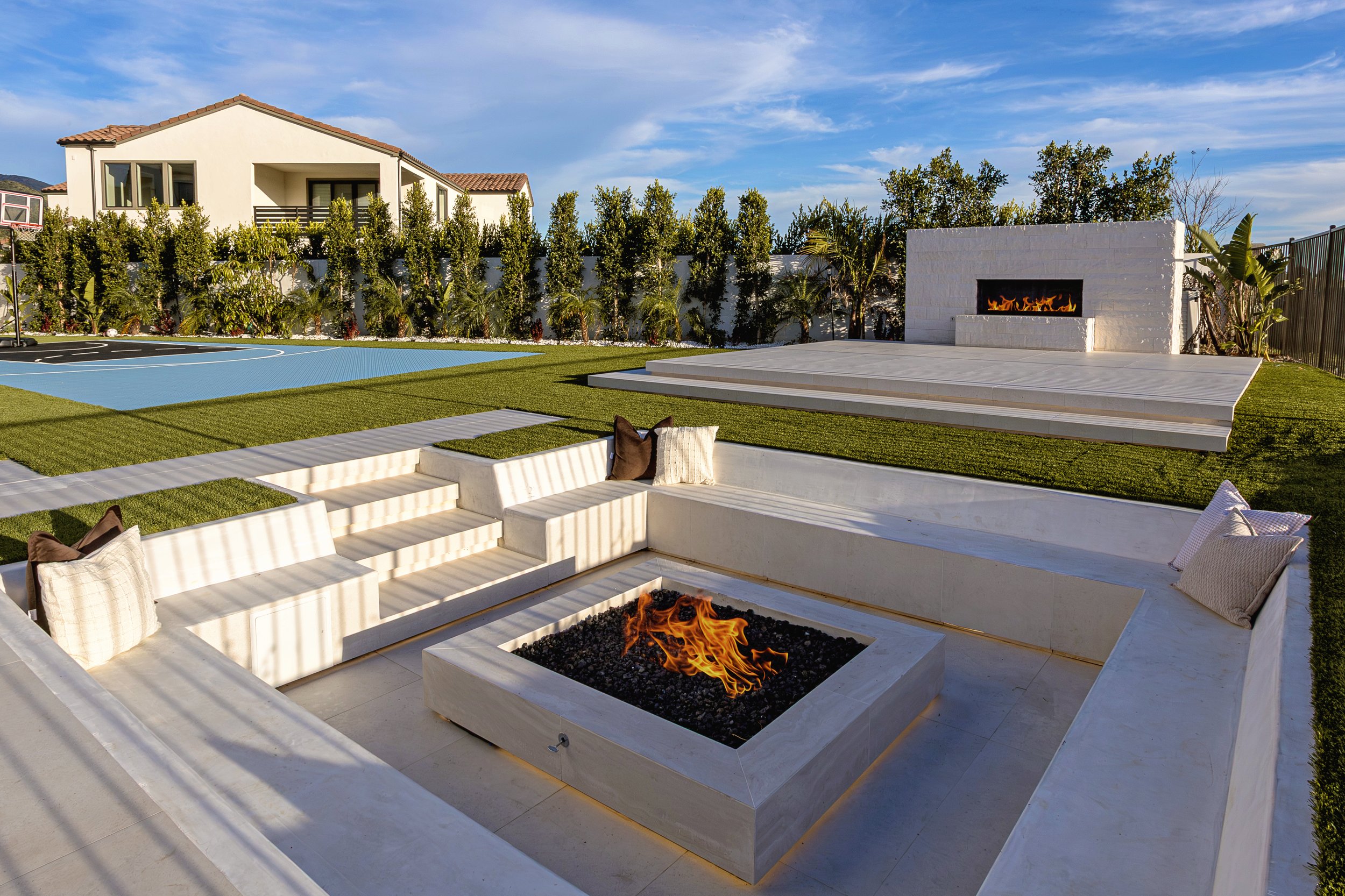 silverado-canyon-sunken-fire-pit-concrete-bench-seating-outdoor-fireplace-sport-court-turf.jpg