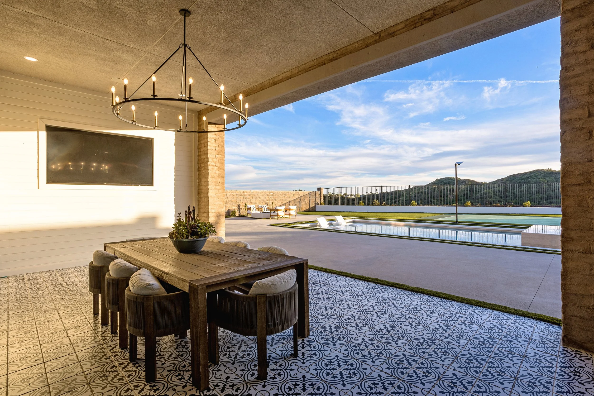 silverado-canyon-covered-patio-outdoor-dining-chandelier-patterned-tile-pool-mountain-views.jpg