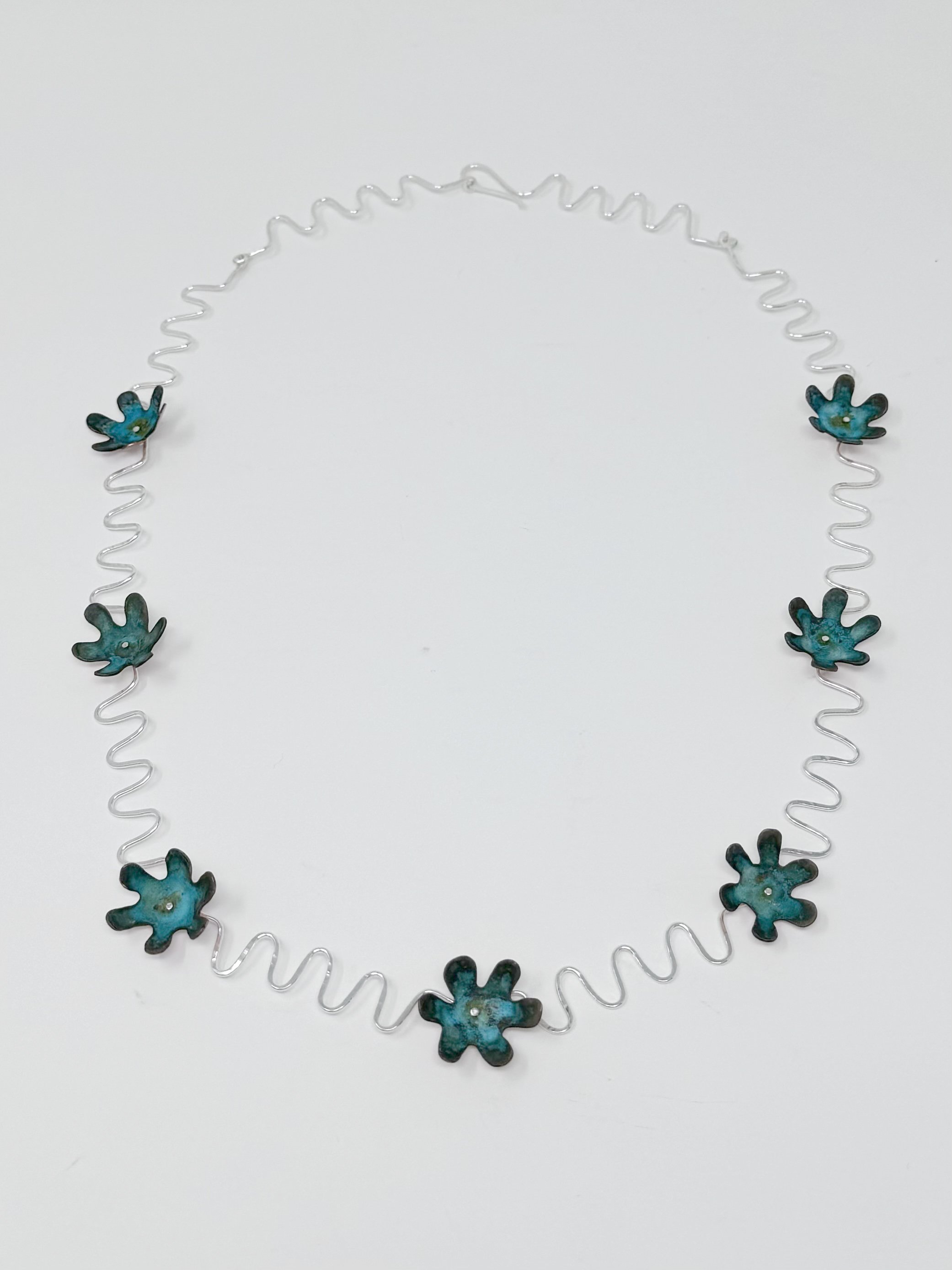 Electric, 2024, sterling silver, copper, patina