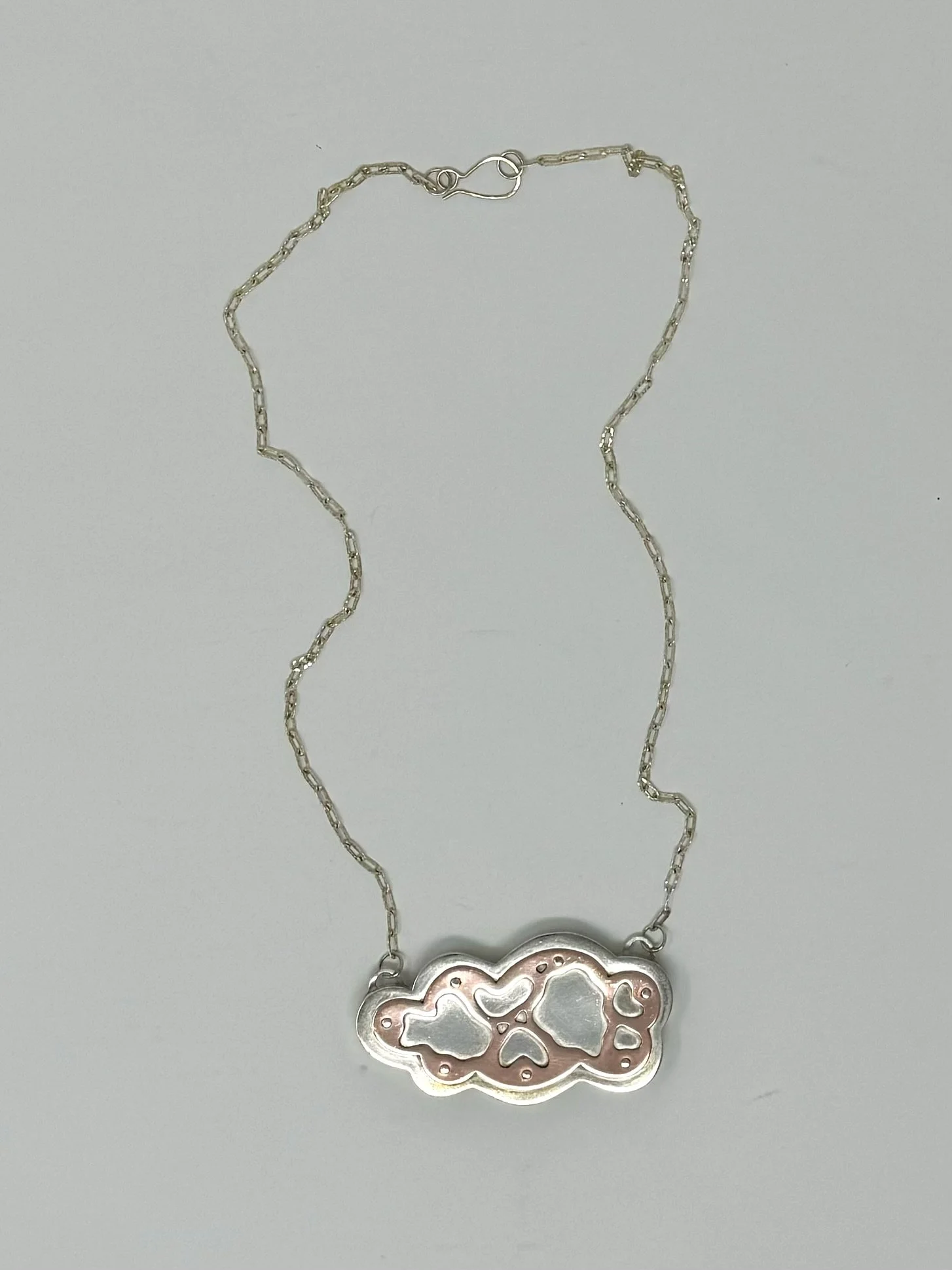 Cloud Locket, 2024, silver, brass, wool