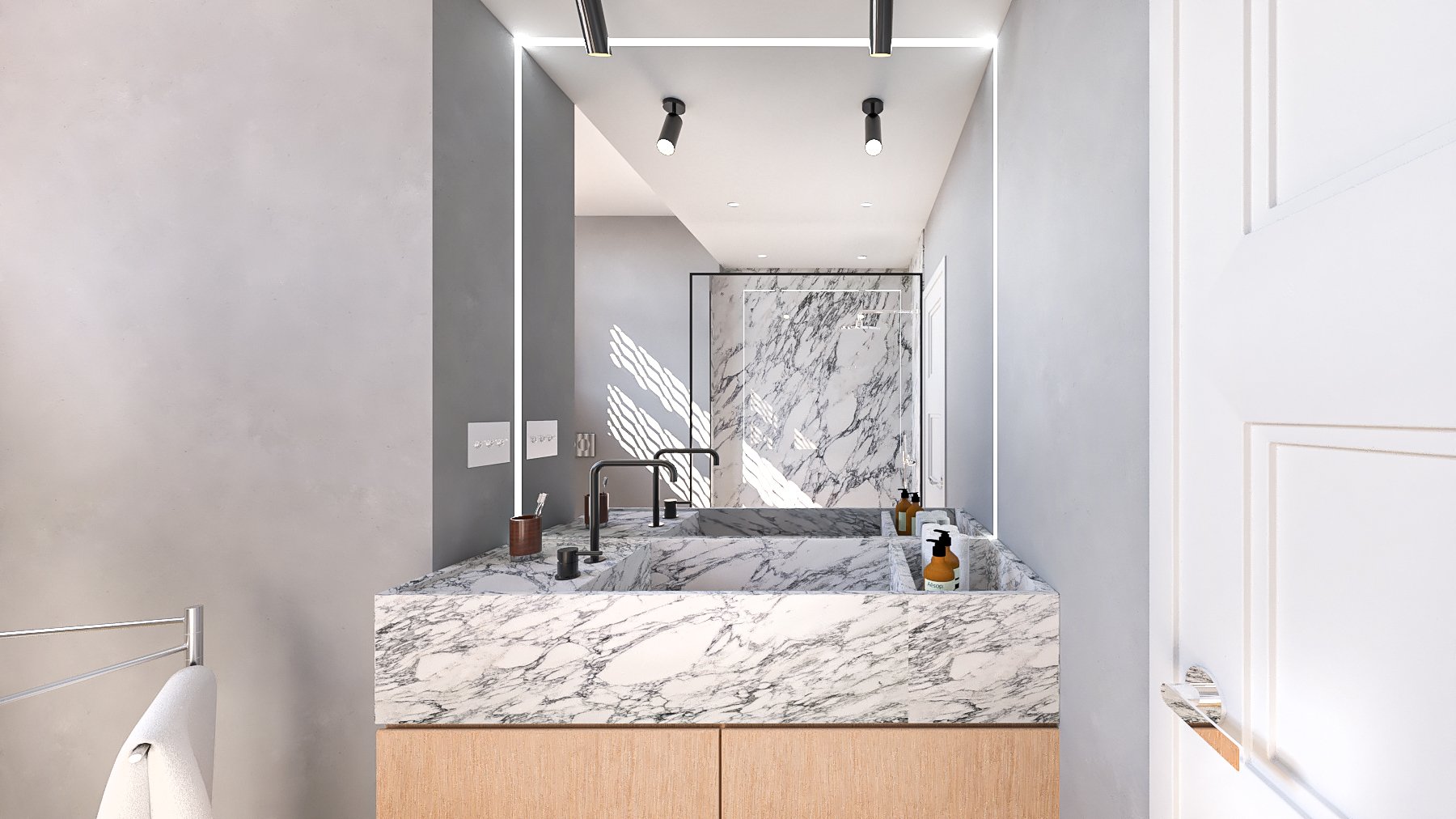 Lavabo in marmo con due rubinetti e detergenti, specchio e luci sopra in un bagno moderno con pareti grigie