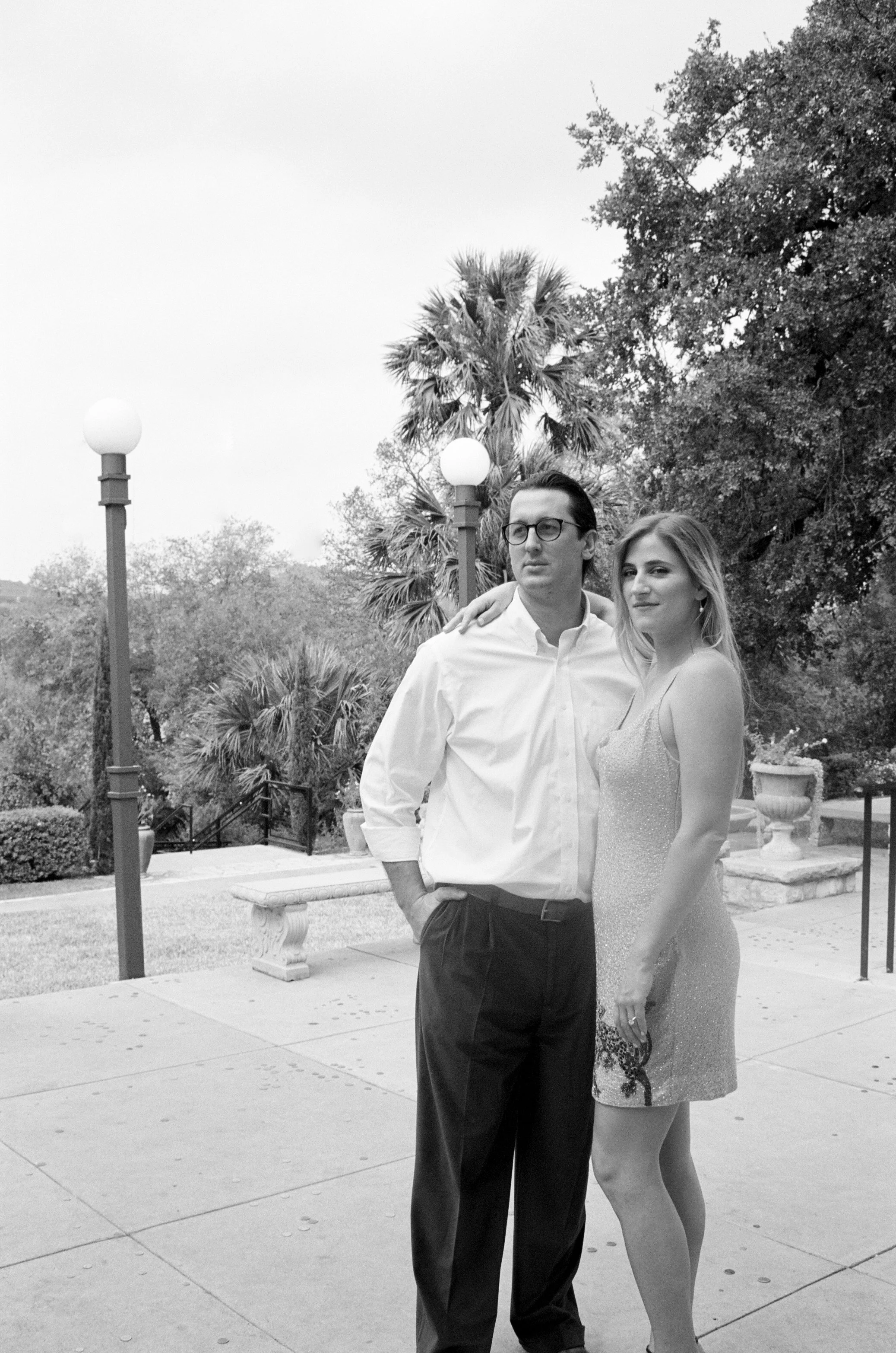 black and white photo of couple in courtyard