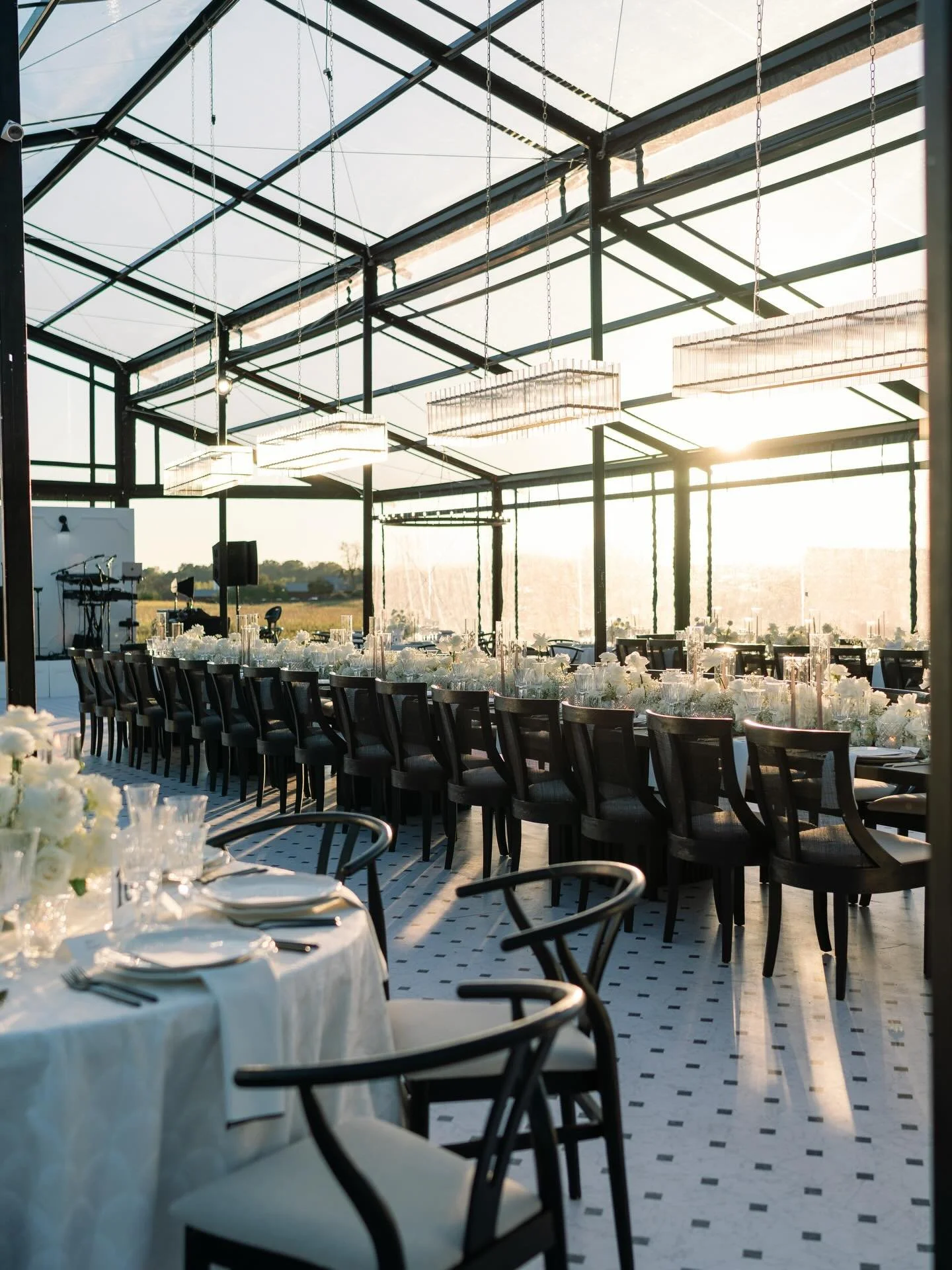 Black, white, and a whole lot of drama.

This design didn&rsquo;t hold back when it came to bold blacks, crisp whites, and florals that did the heavy lifting. From structured centerpieces to a floral canopy of cream and texture for the ceremony, ever