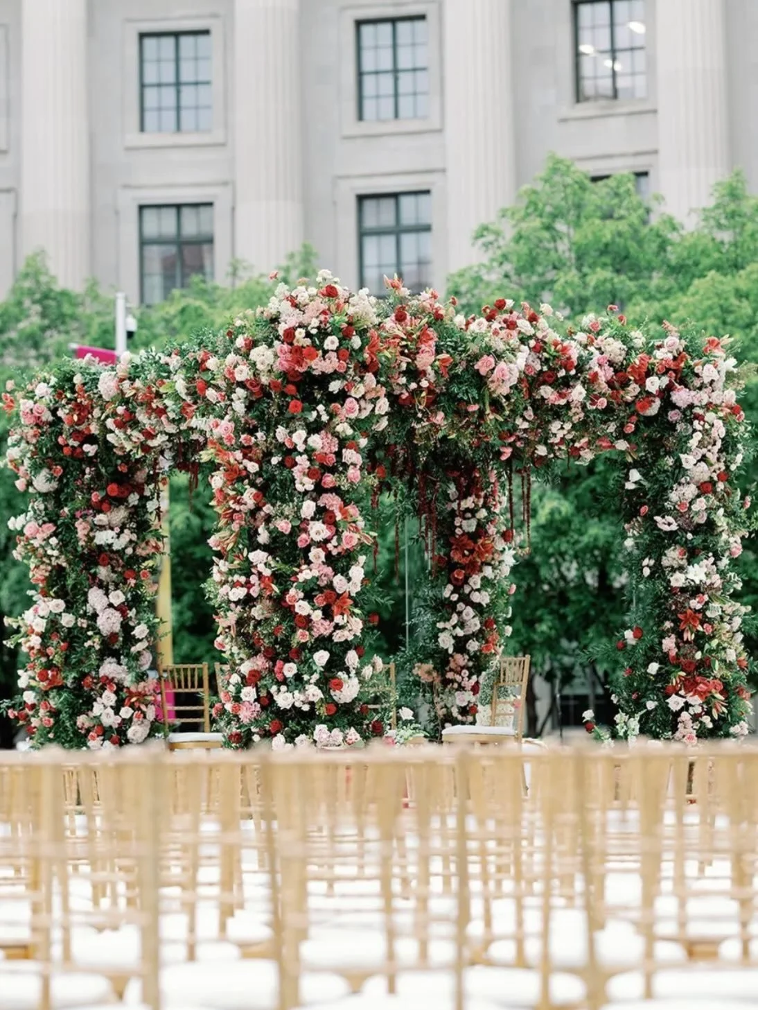 This ceremony started with the mandap.

The couple wanted something rooted in tradition that could still hold its own with the scale of the Ronald Reagan Building. That meant being intentional about height, spacing, and structure.

Layered pinks, cor
