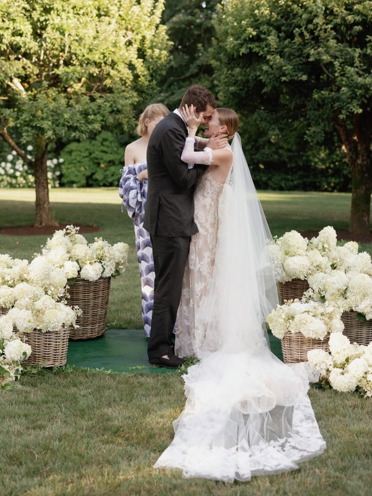 How do you make a tent feel like it grew out of the landscape?

We started with in-season limelight hydrangea and oak leaf, and added Confederate jasmine vine for softness. Then we built custom greenery trellises to cover every tent pole, carrying th