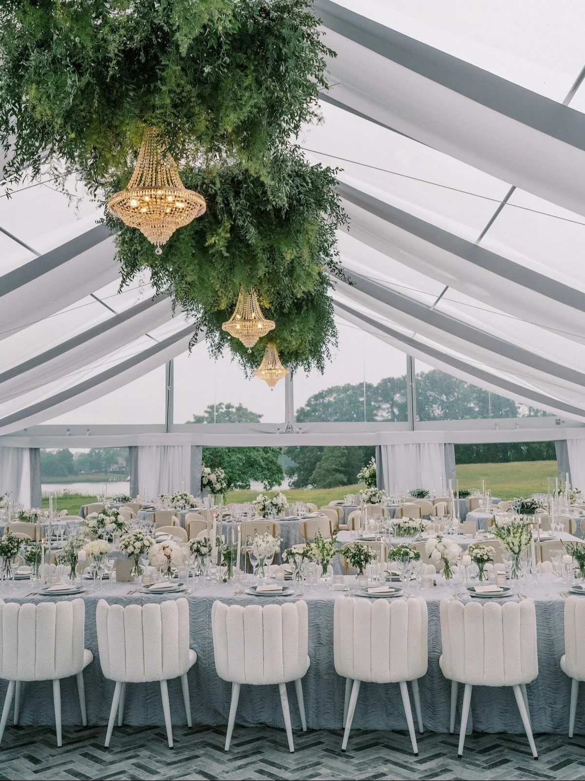 This design was built around a classic white and green palette.

From the tables to the elevated arrangements and layered greenery, each element worked together to shape a space that felt welcoming, balanced, and fully considered for the celebration.