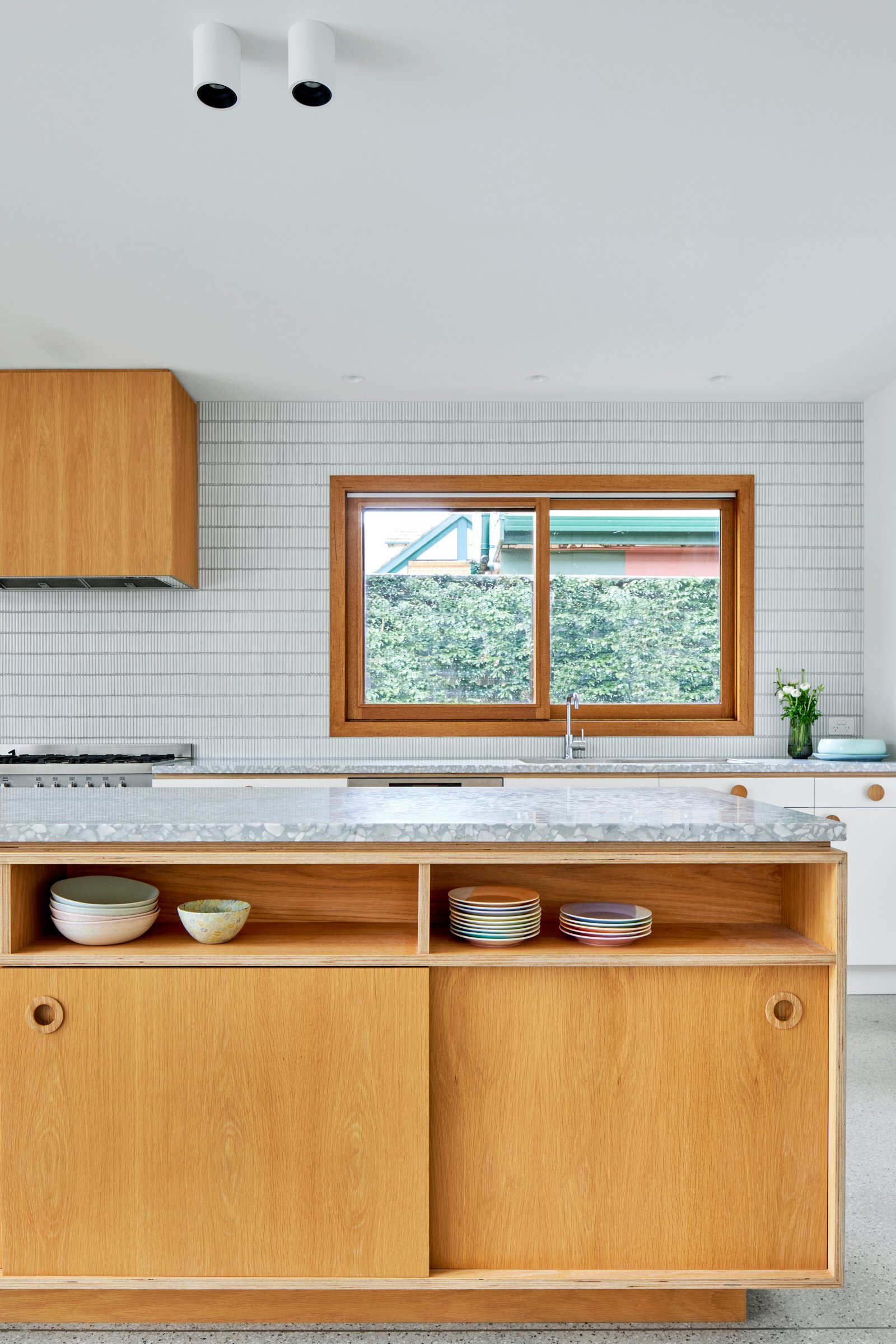 Warm oak, soft whites and tactile terrazzo create a relaxed, light-filled Bayside feel.